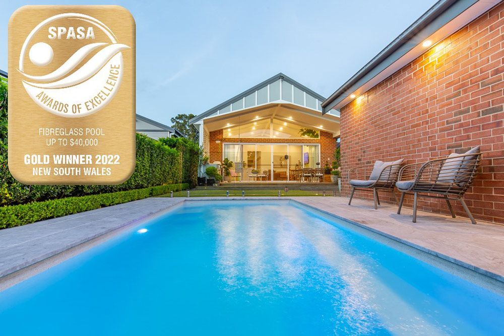 Modern House With Large Glasses And Swimming Pool — Swimming Pool in Newcastle, NSW