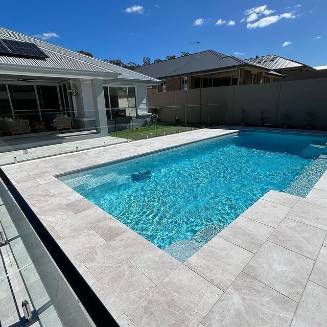 A Large Swimming Pool In Front Of A House — Swimming Pool in Scone, NSW