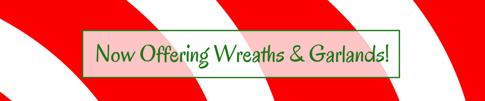 Sign advertising wreaths and garlands on a red-and-white striped background