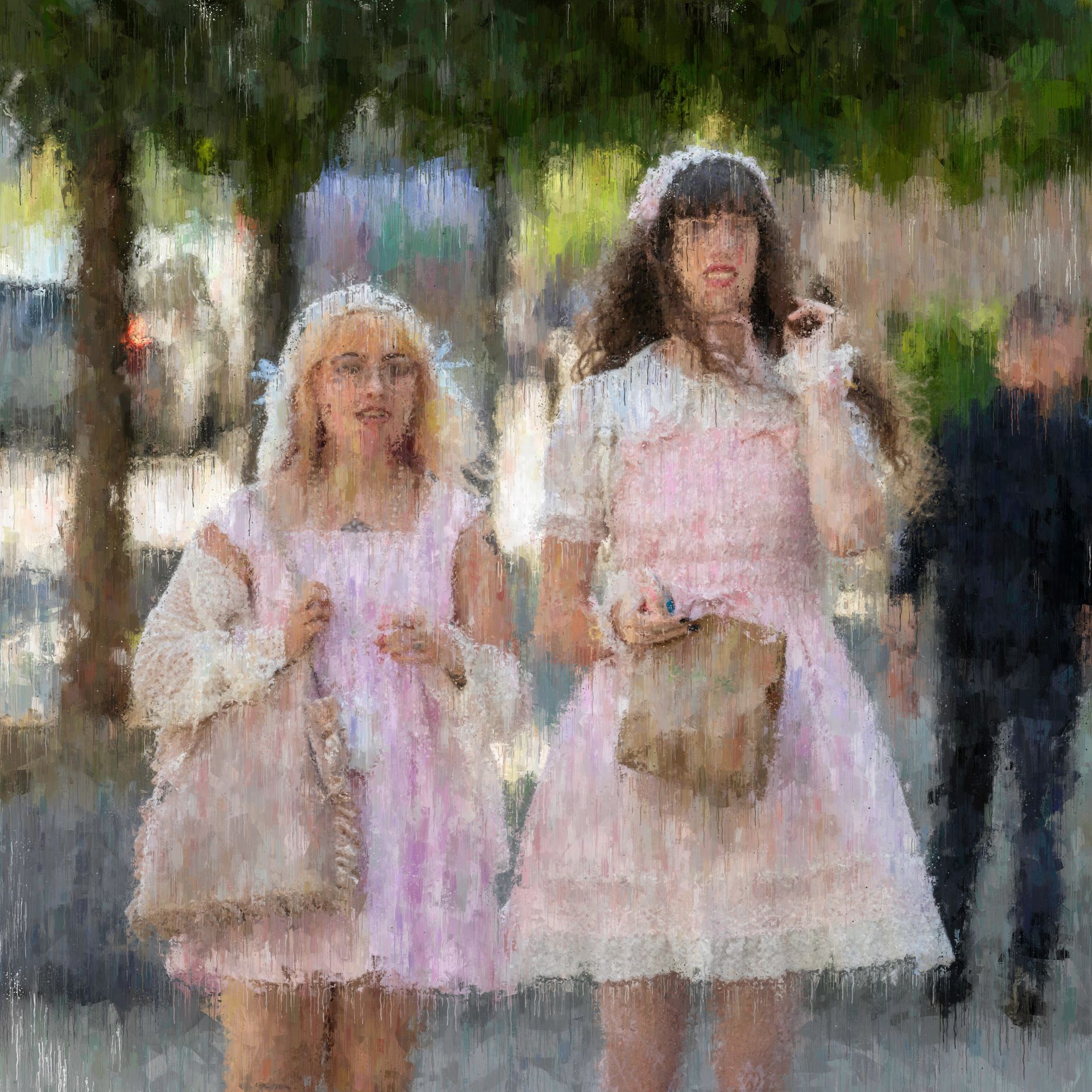Two people wearing pink dresses, walking on a sidewalk. One holds a purse, the other a small bag. A person is blurred in the background.