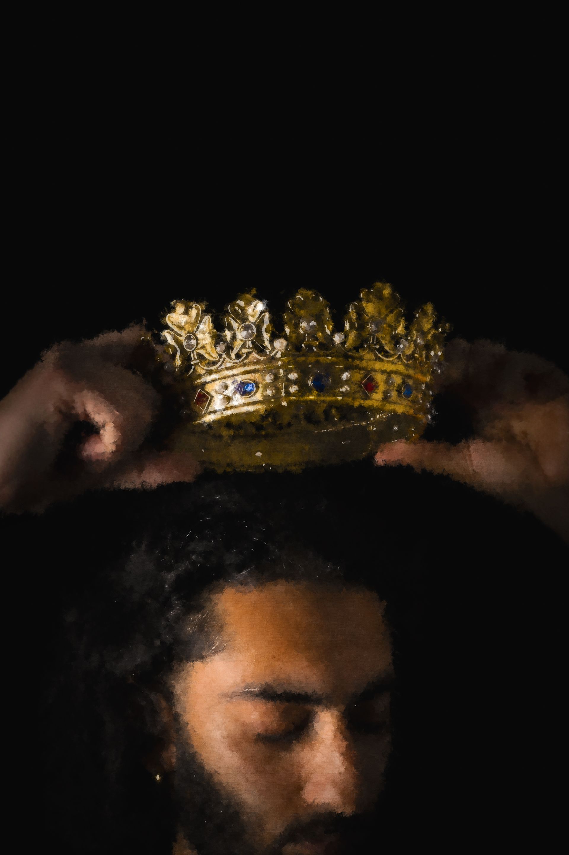 Hands placing a golden crown on a person's head, against a black background.