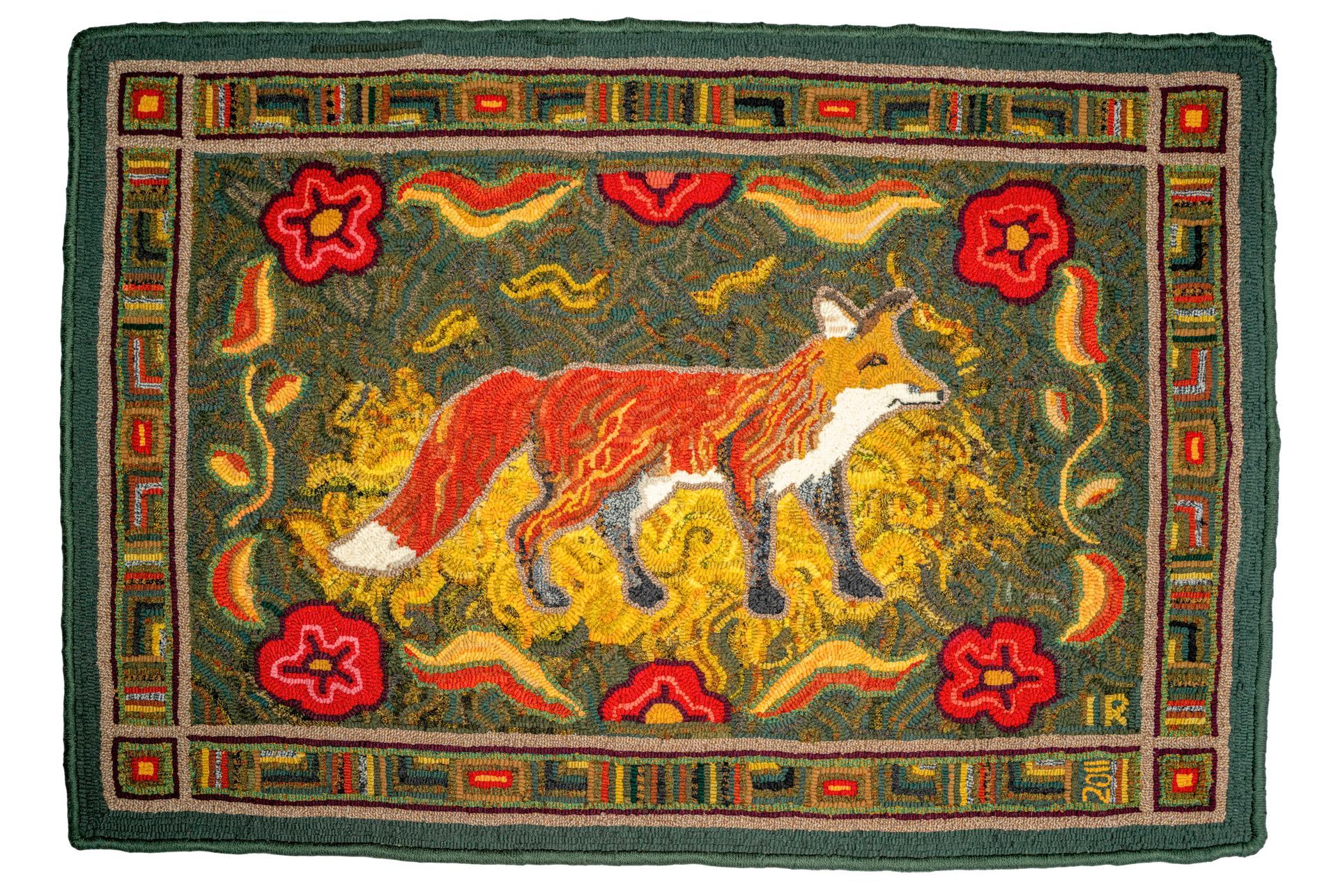 Rug with a fox standing, surrounded by red flowers and a decorative border.