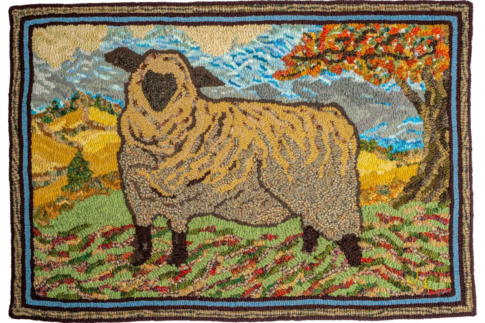 Rug with sheep in autumn landscape. Yellow sheep, orange tree, mountains.