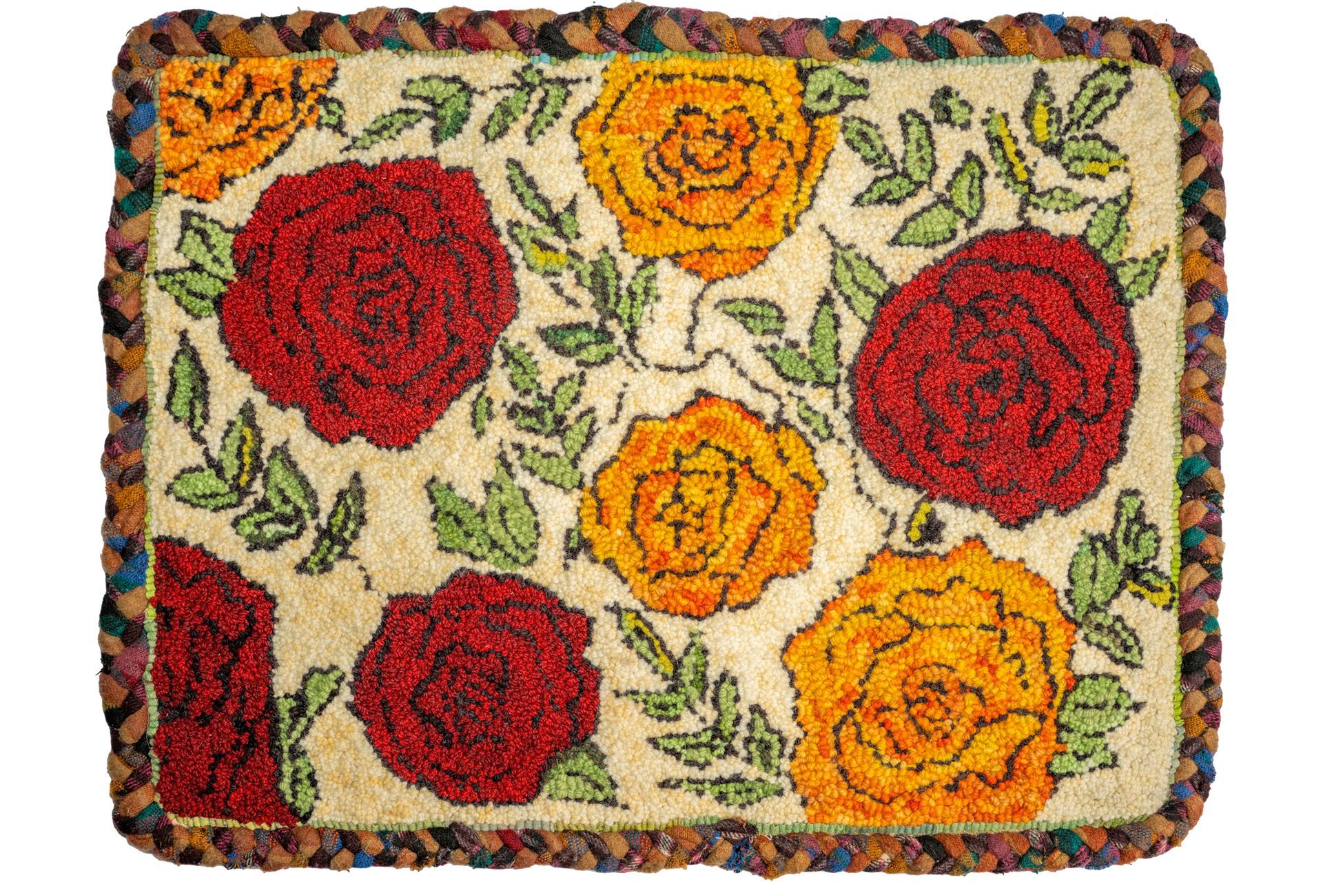 Floral hooked rug with red and yellow roses, green leaves, and braided border.