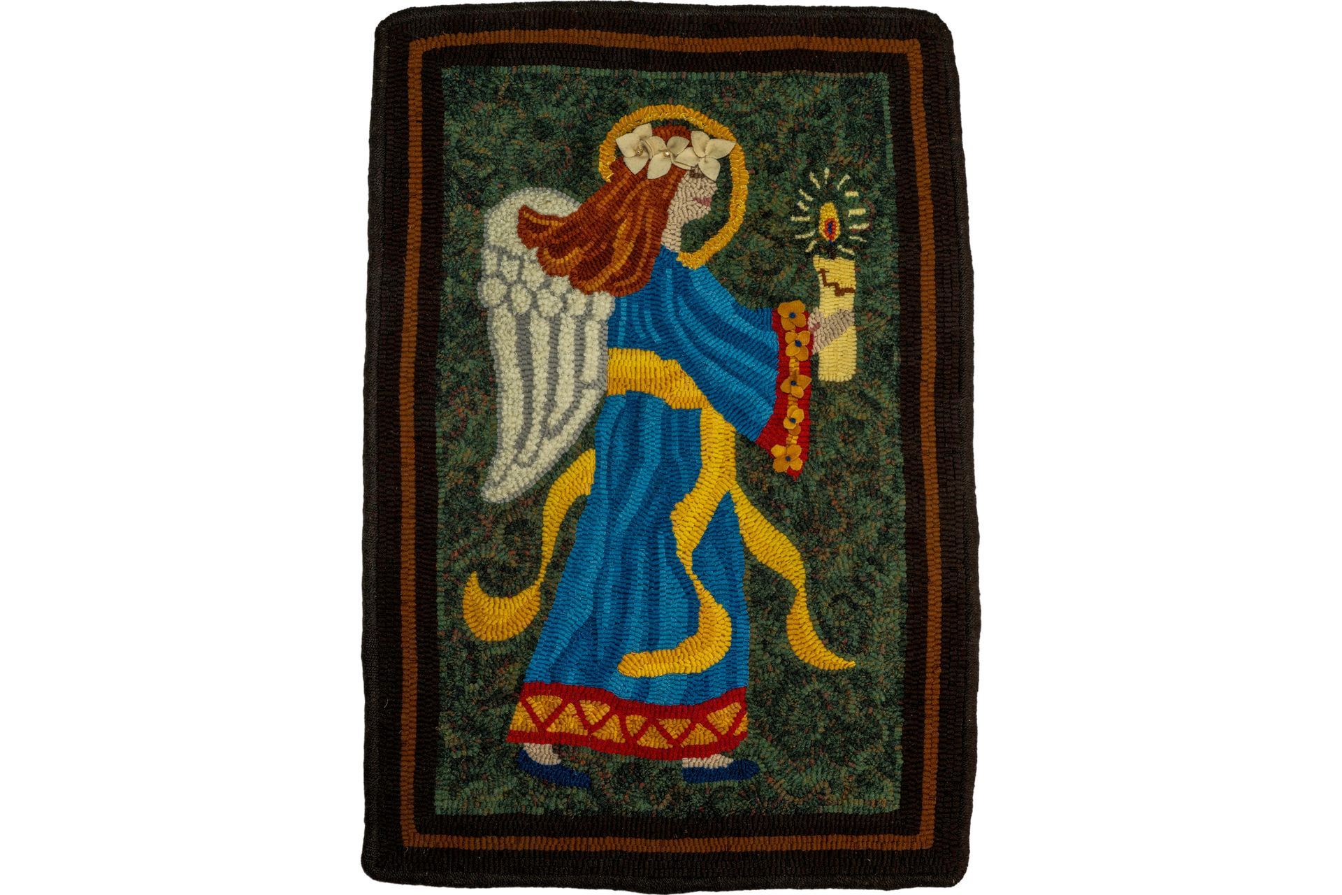 Angel holding candle, in blue robe, with halo and wings. Brown border, green background.