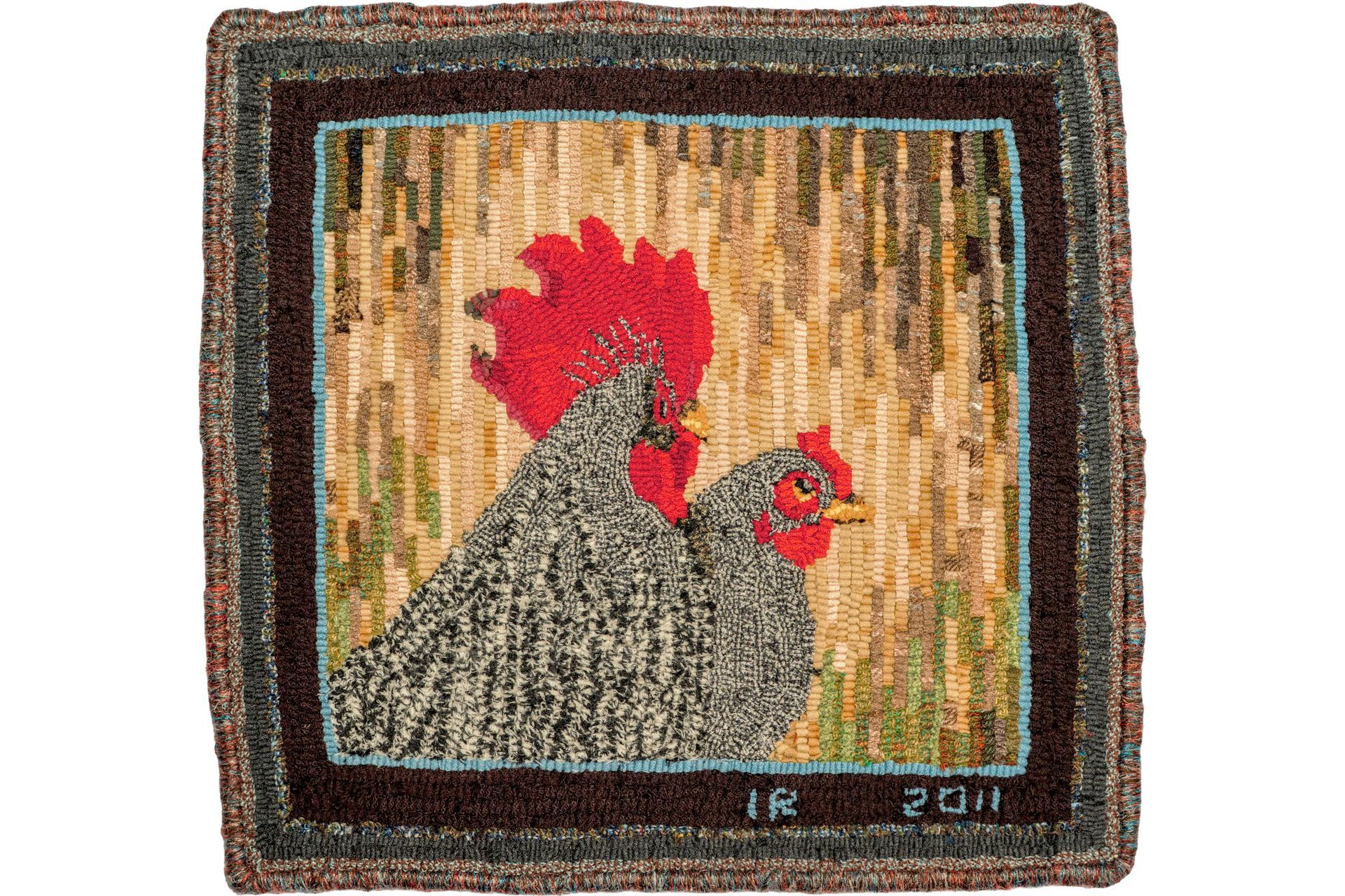 Rug depicting two chickens: gray hen, red comb rooster, brown and beige background, square frame.