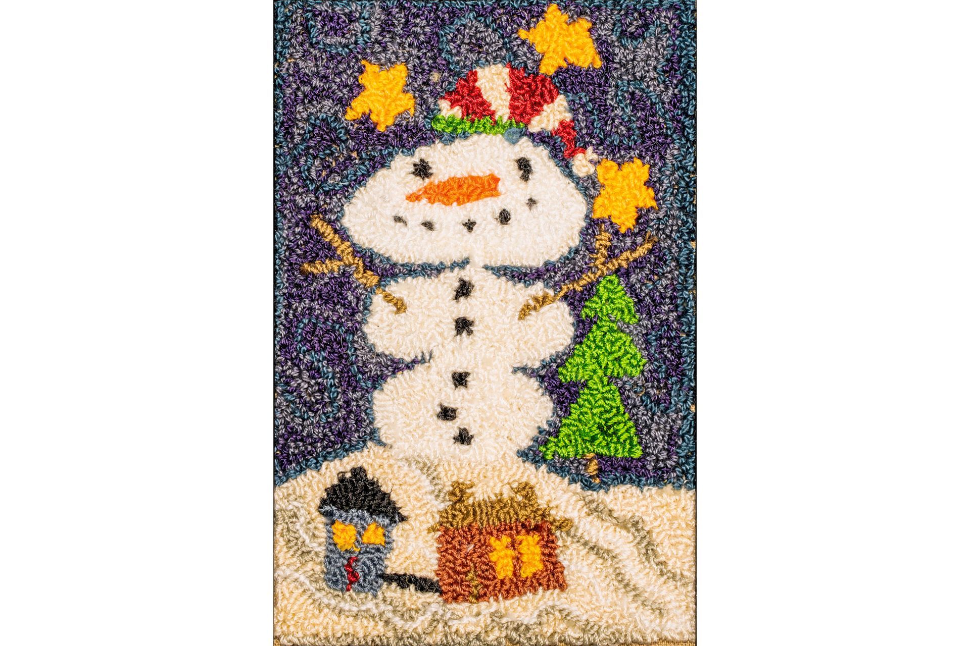 Snowman with candy cane hat, stars, and houses on a snowy hill; a winter scene.