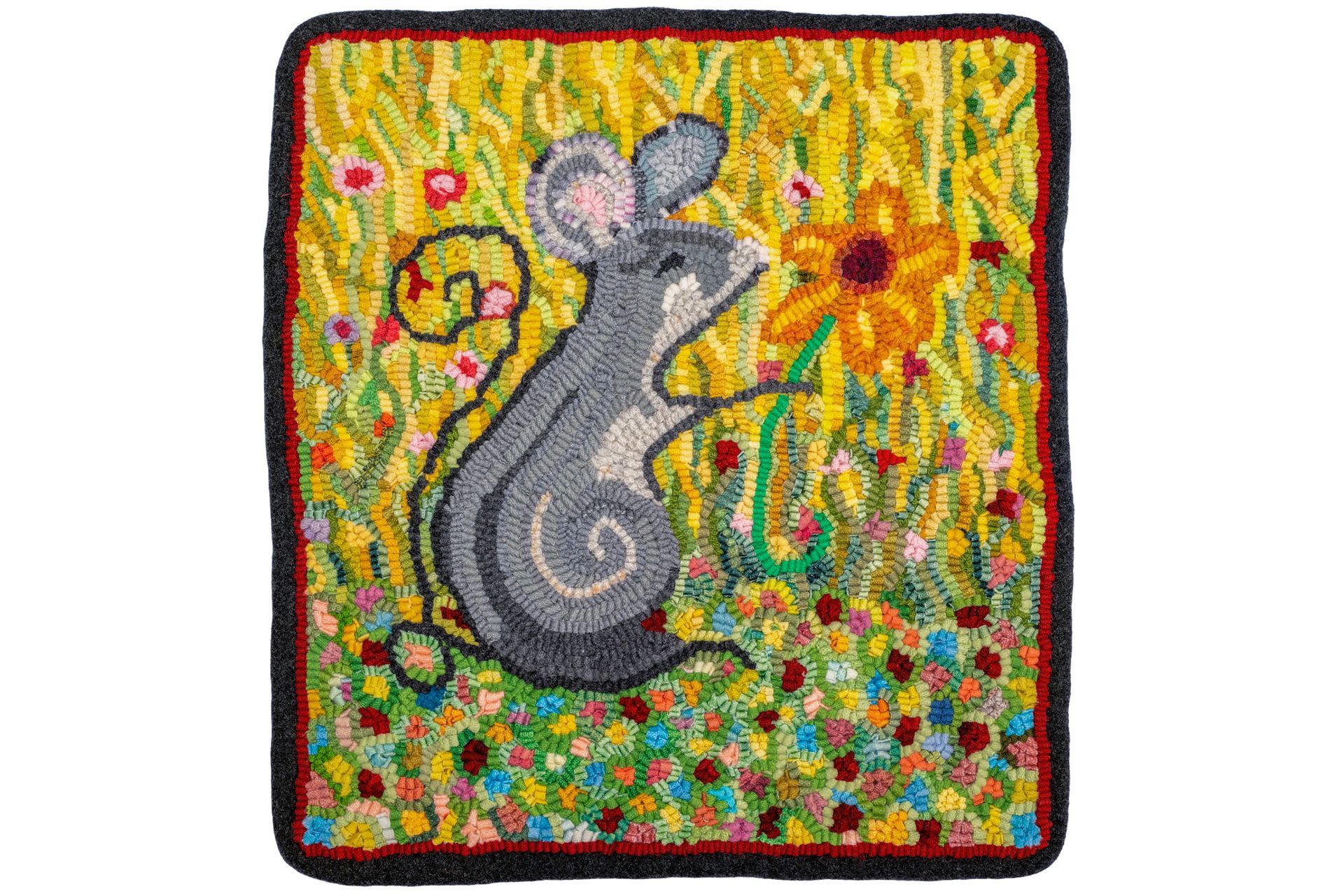 Mouse sniffing a yellow flower in a colorful meadow, stitched rug.