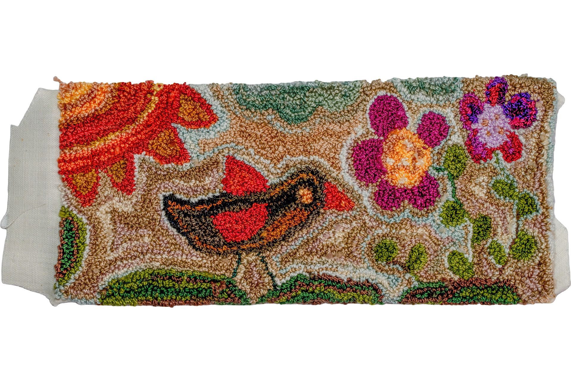 Hand-hooked textile art depicting a bird, flowers, and a sun in vibrant colors.