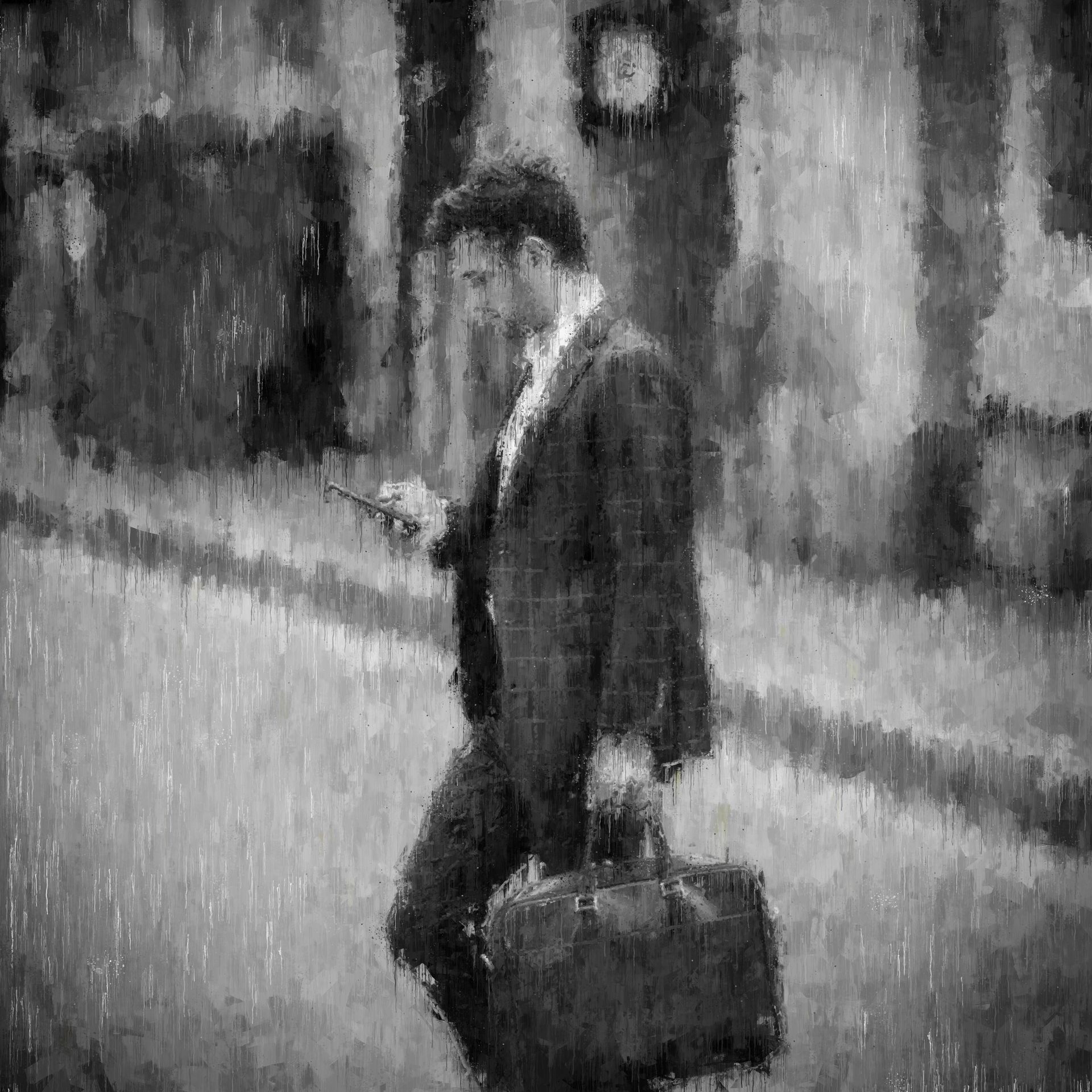 Man in suit walking, looking at phone, holding briefcase, city street background.
