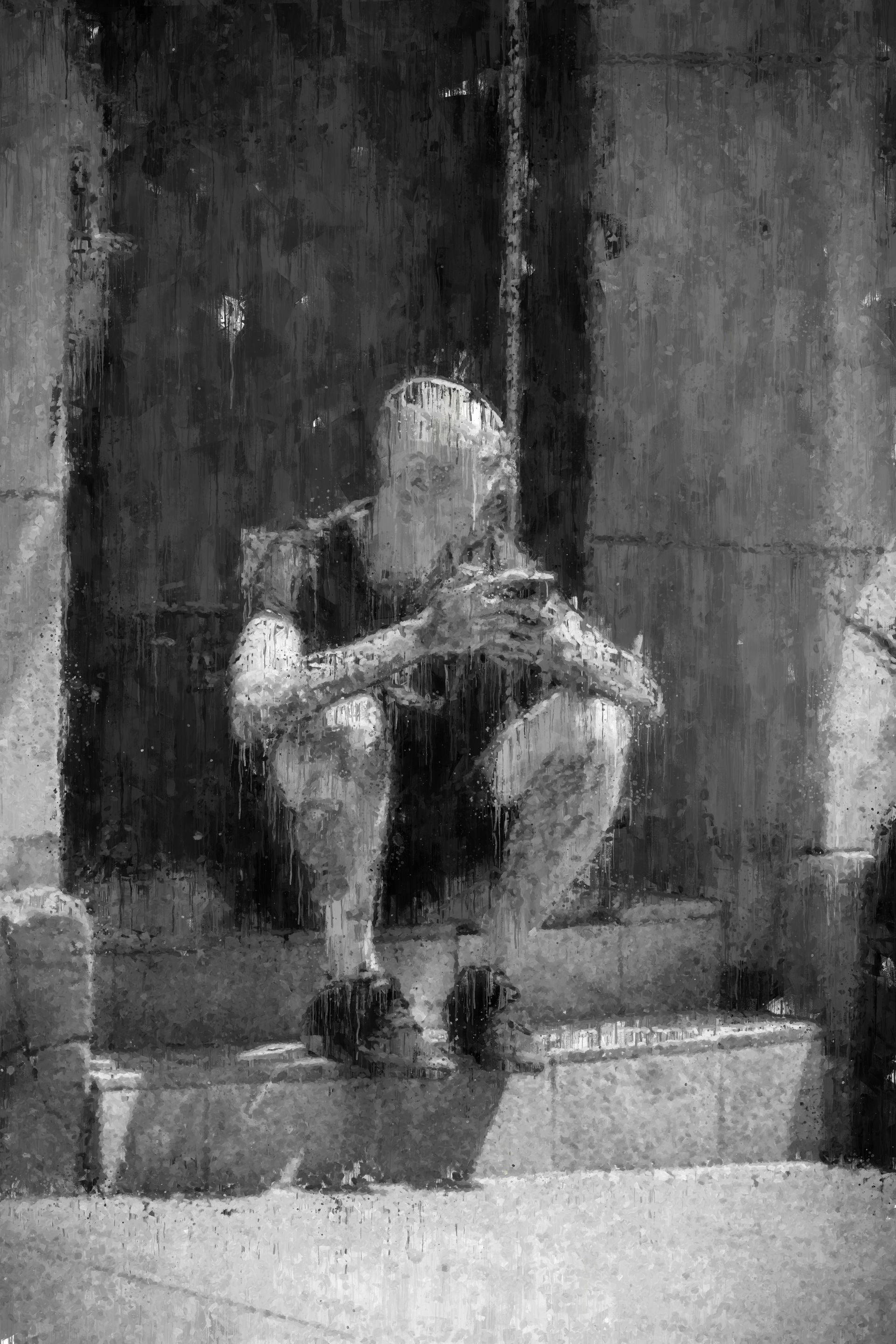 Person sitting on steps, head down, hands clasped, dark clothing, in front of a shadowed doorway.