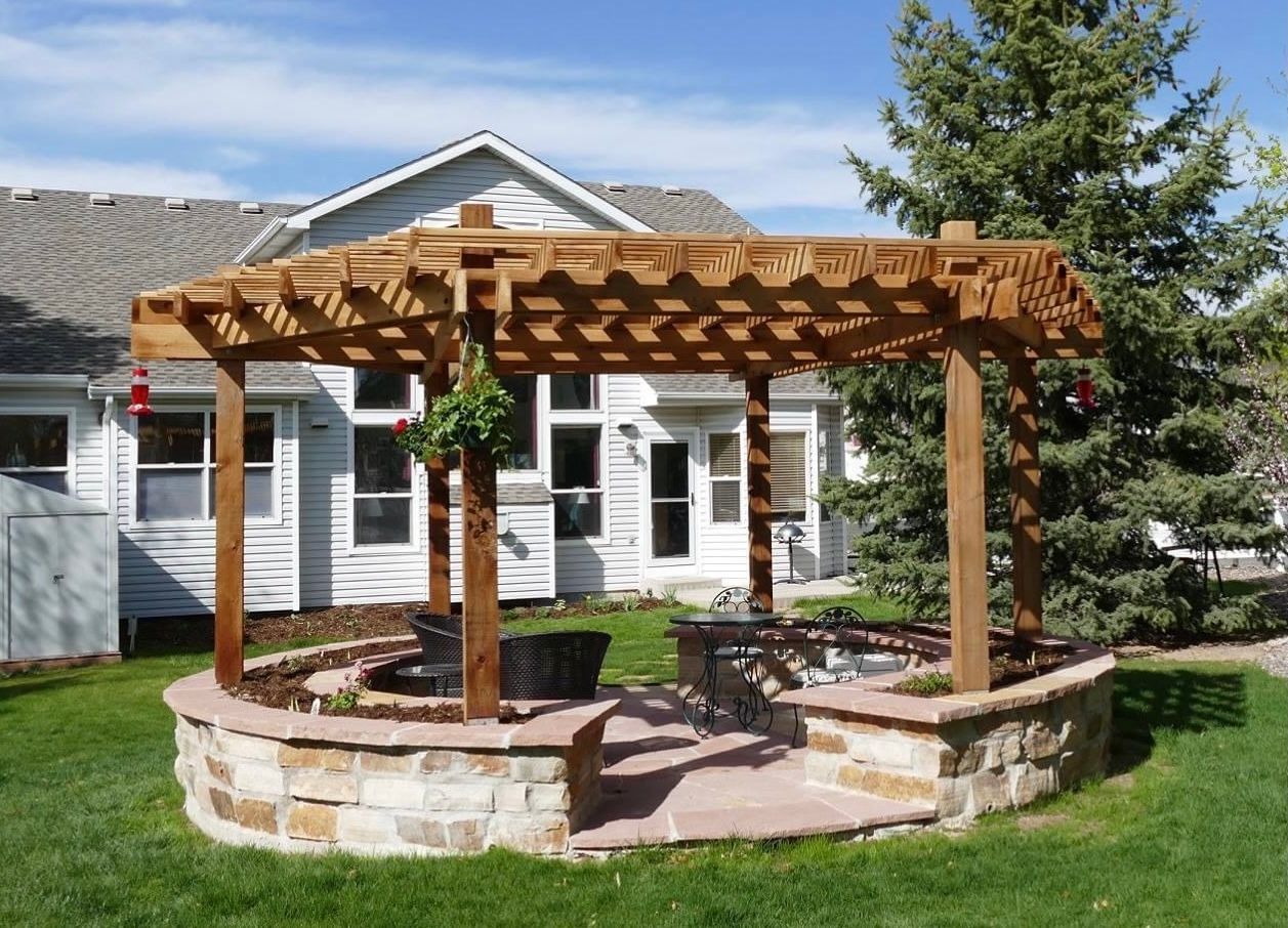 A house with a pergola in front of it