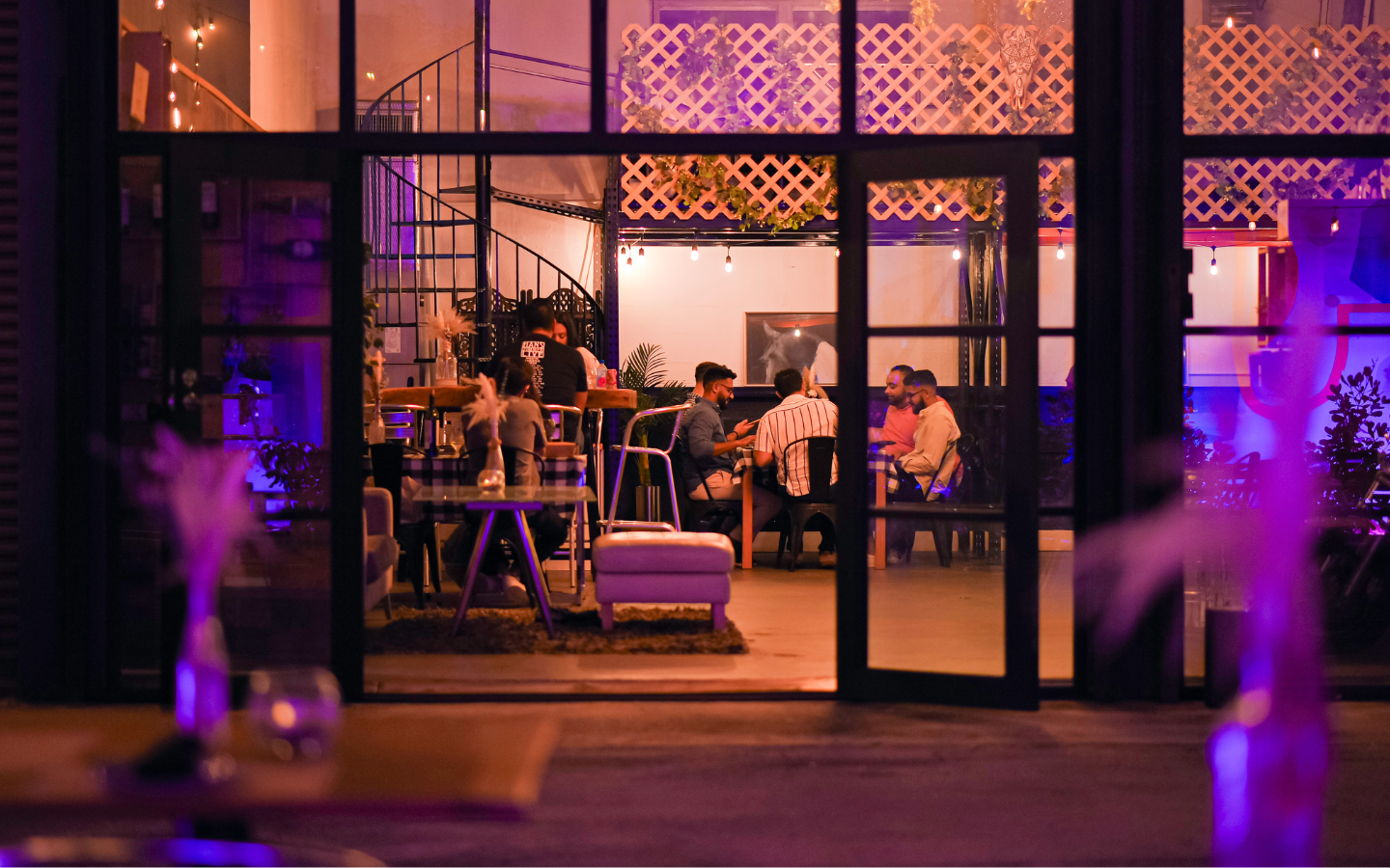  La Wagyeria Miami at night with outdoor seating and neon signage
