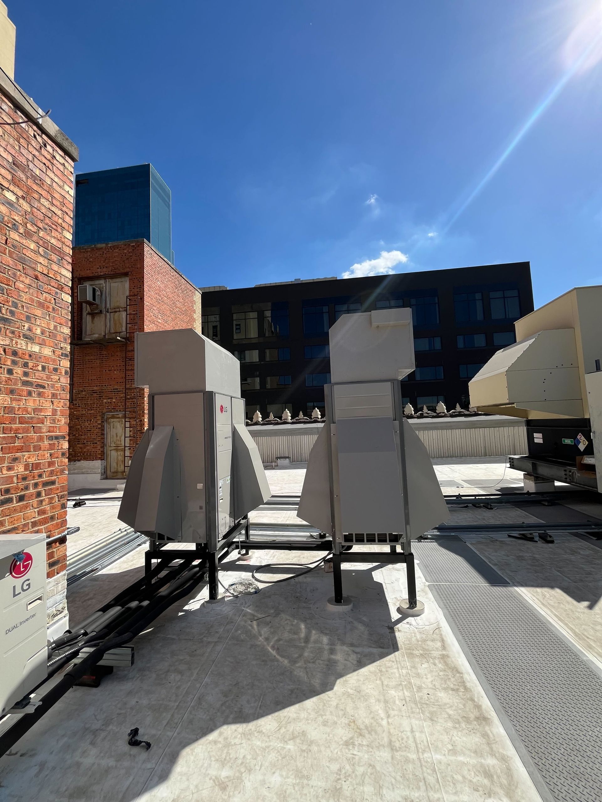 A building with a lot of air ducts on the roof