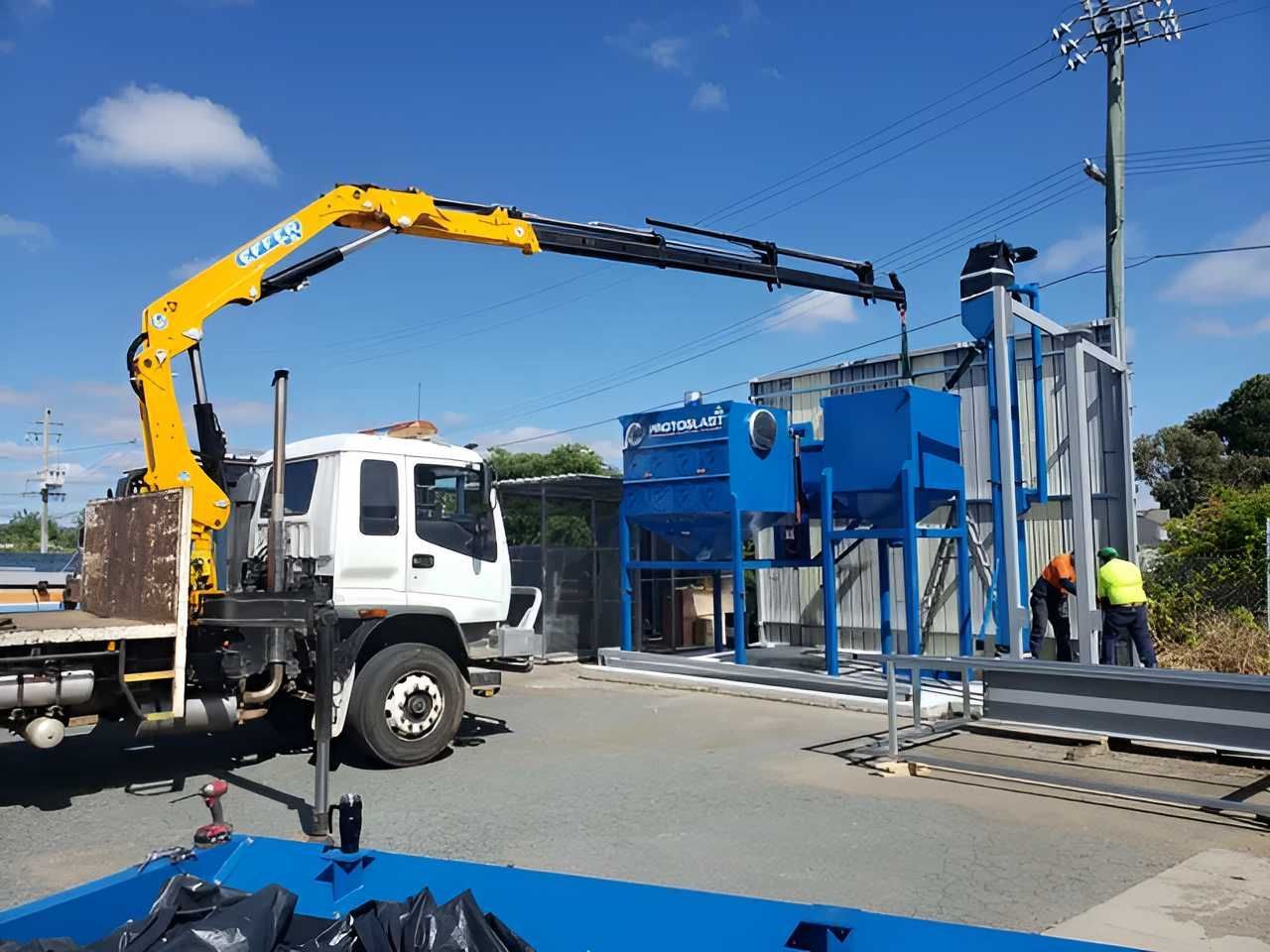 A Yellow Crane is Attached to the Back of a Truck — Alexander Crane Tippers in Latham, ACT