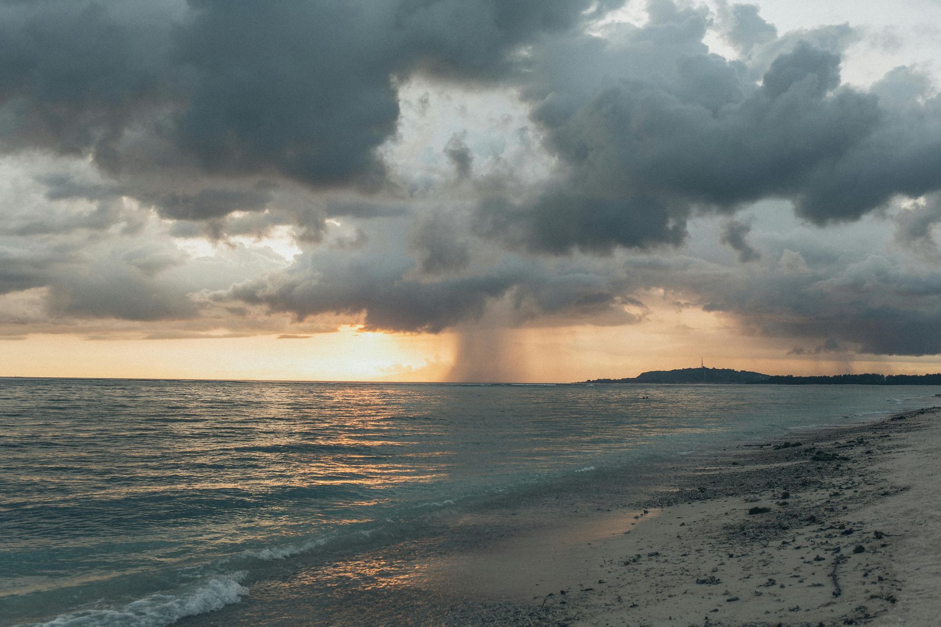 rain storm coming down on a beach