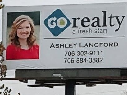 A billboard on top of a brick building that says made in usa