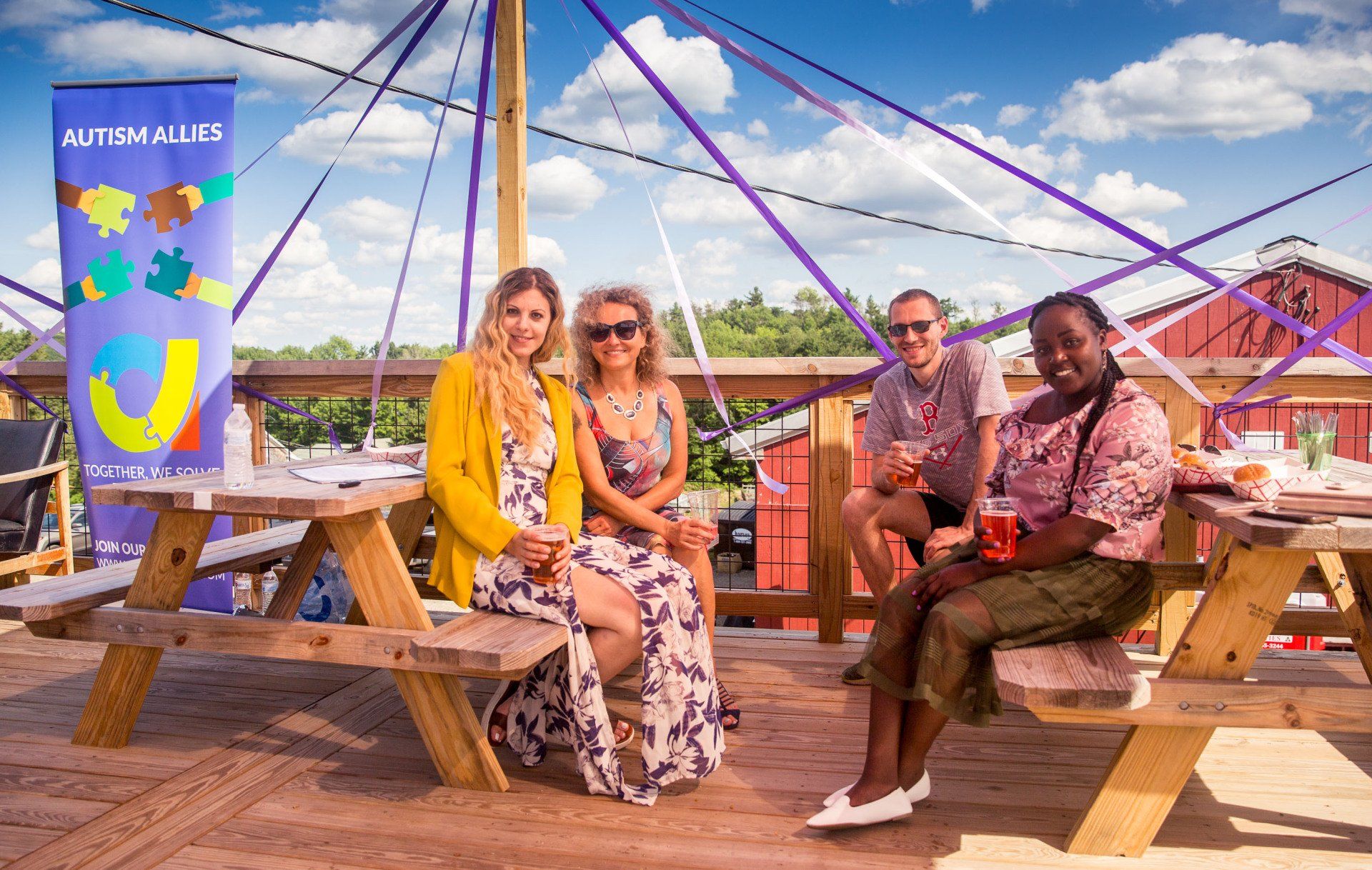 A group of people are sitting at a picnic table.