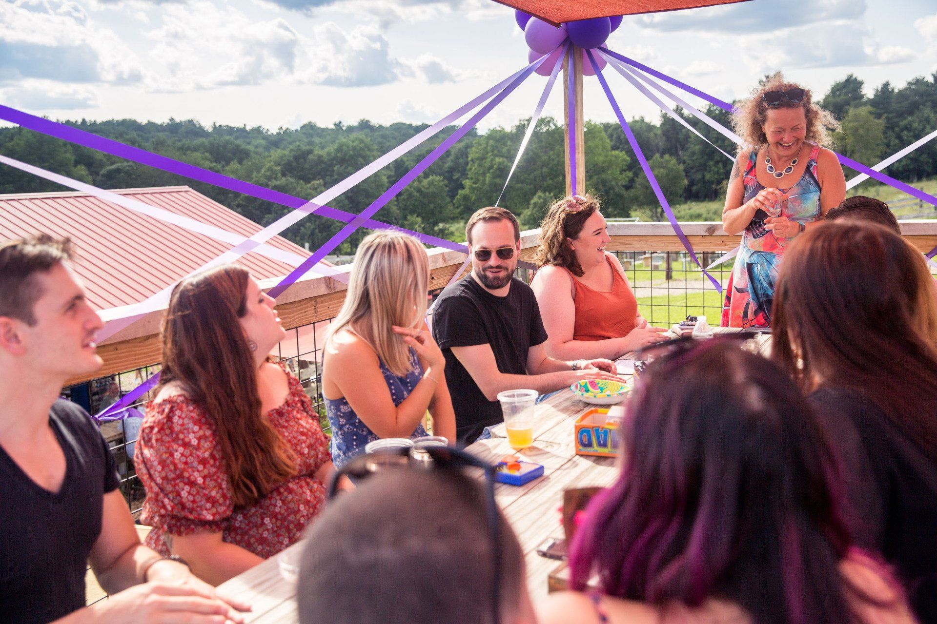 A group of people are sitting around a table.