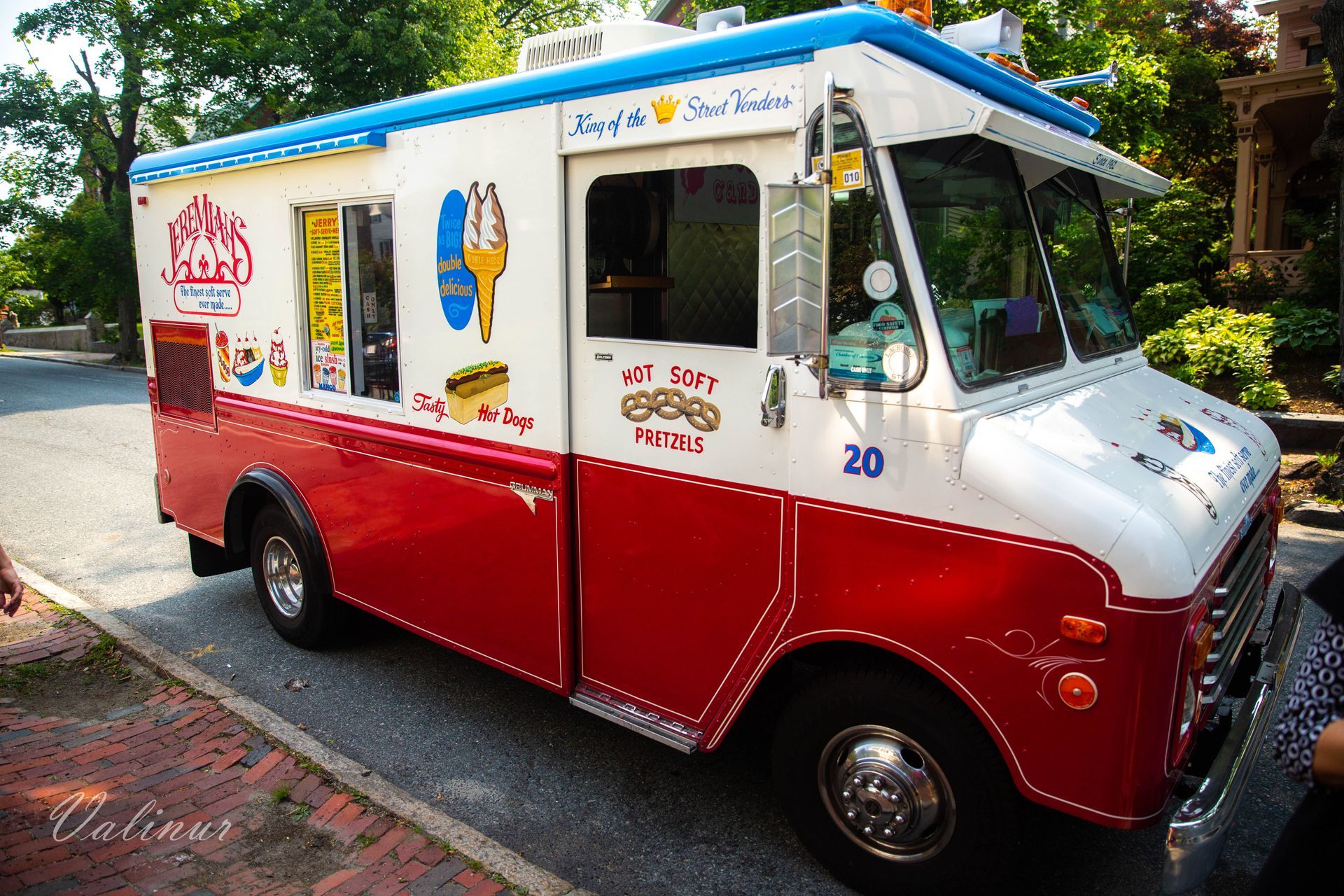A red and white ice cream truck with the number 20 on the side
