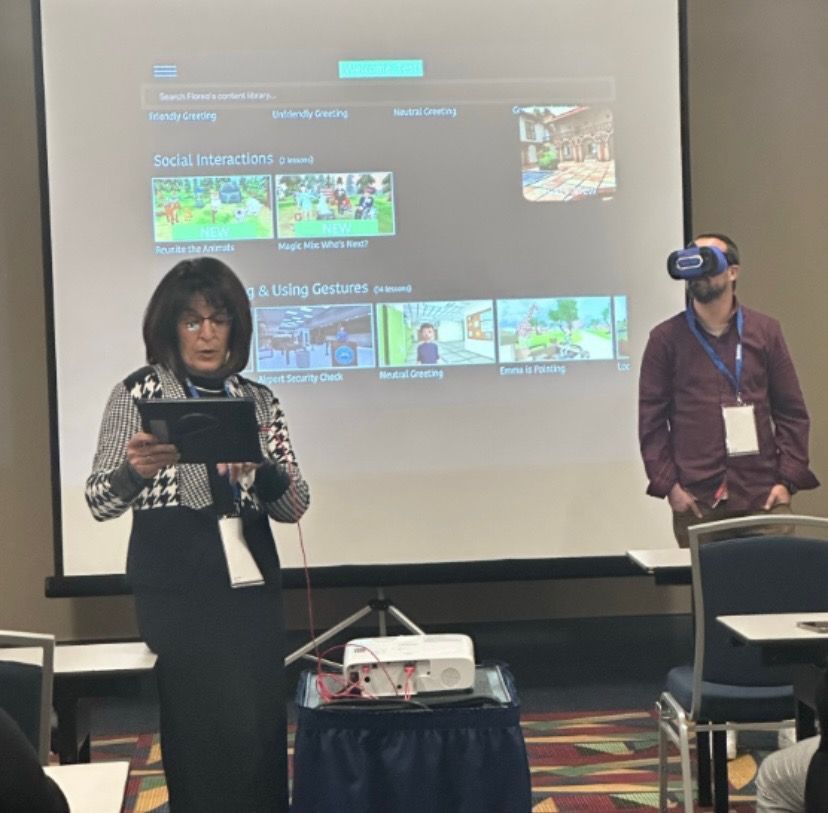 A man wearing a virtual reality headset is giving a presentation