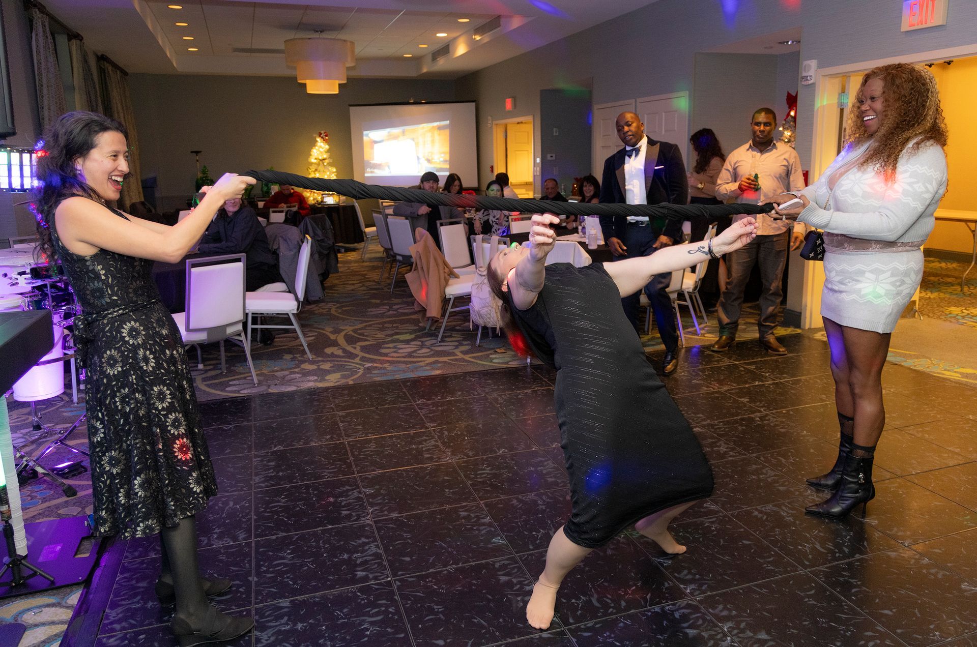 A group of people are playing a game in a room.