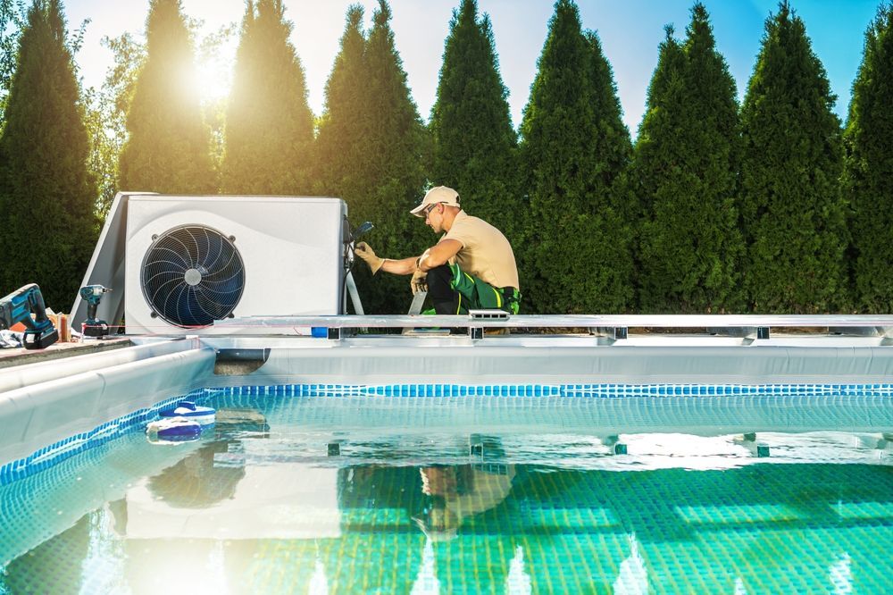 Poolside Worker Installing Pool Heater Near a Swimming Pool — Clearwater Pools Hallidays Point in Diamond Beach, NSW