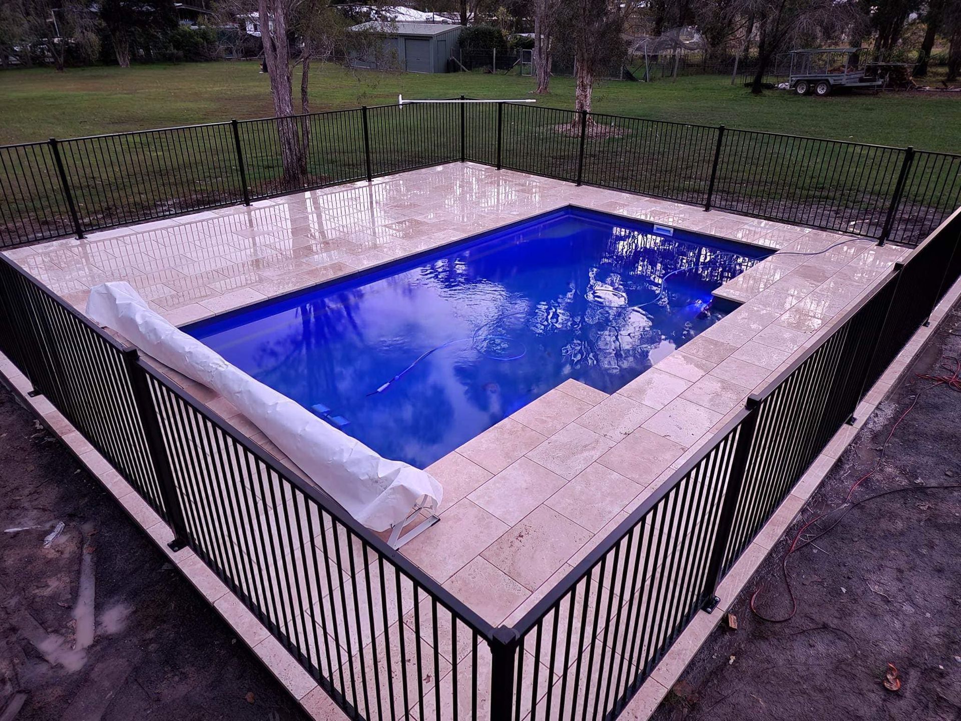 Rectangular Pool With Blue Water and Tan Tile Surround — Clearwater Pools Hallidays Point in Diamond Beach, NSW