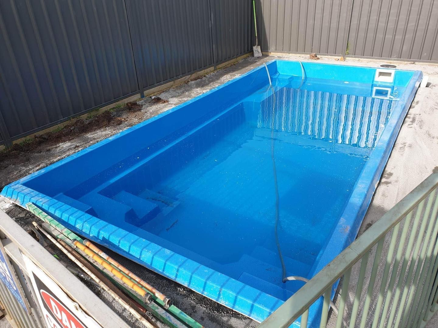 Blue Rectangular Pool, Partially Filled, Surrounded by Concrete — Clearwater Pools Hallidays Point in Pacific Palms, NSW
