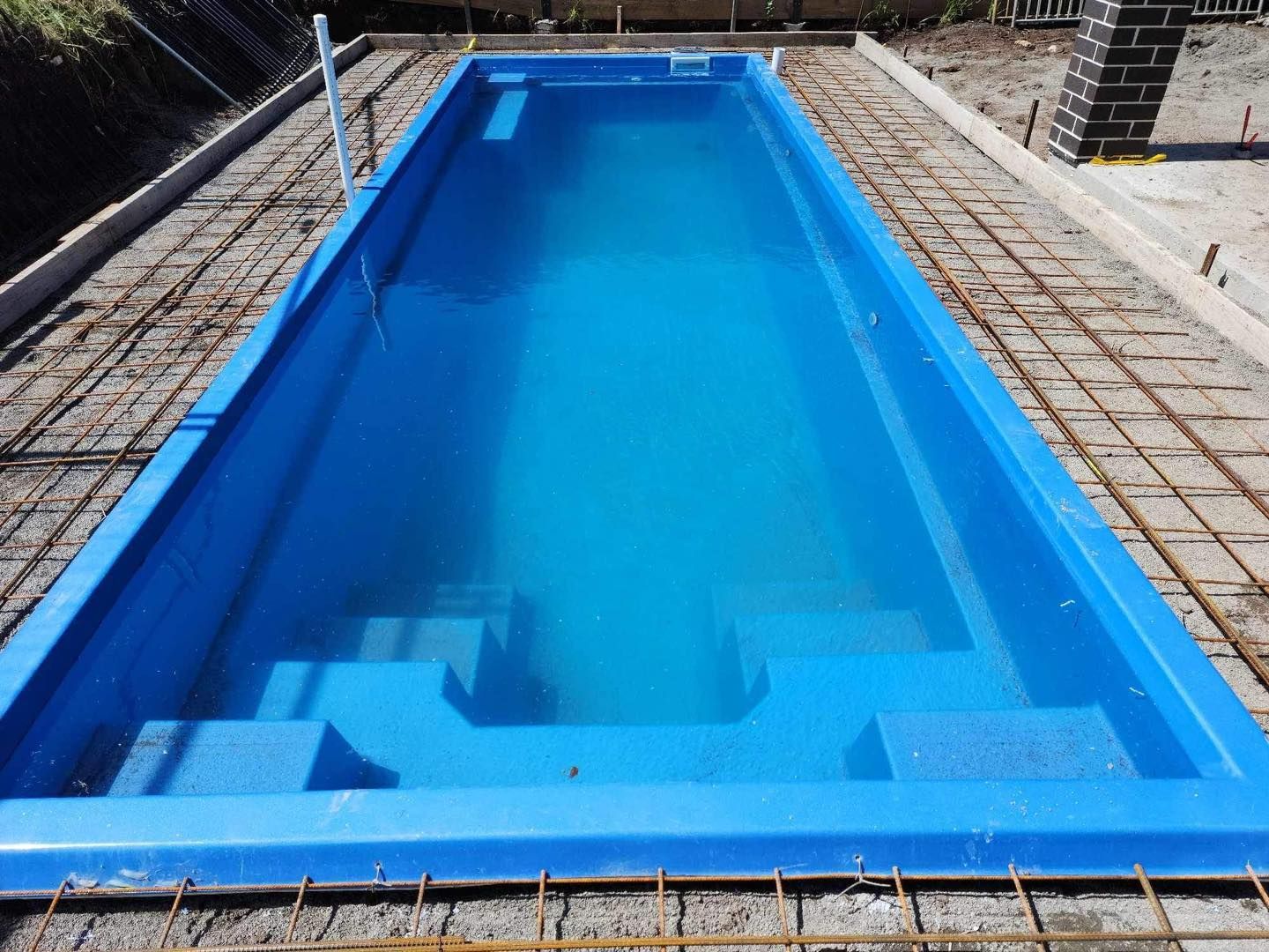 Blue Rectangular Swimming Pool, Filled With Water, Surrounded — Clearwater Pools Hallidays Point in Nabiac, NSW