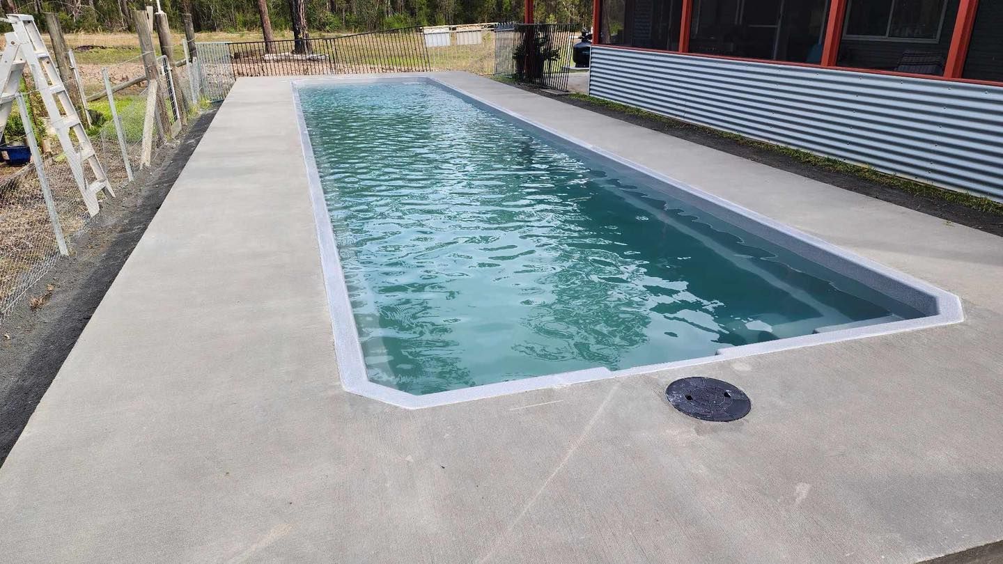 Rectangular Swimming Pool Filled With Water, Surrounded by Concrete — Clearwater Pools Hallidays Point in Nabiac, NSW