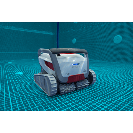 A robotic pool cleaner submerged in a blue-tiled swimming pool. It is white, gray and red.  — Clearwater Pools Hallidays Point in Hallidays Point, NSW