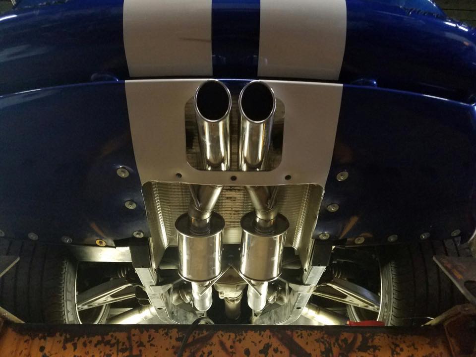 Newly Installed Muffler Of A Blue Car — Marlborough, MA — Lou’s Custom Exhaust Of Worcester/Marlborough