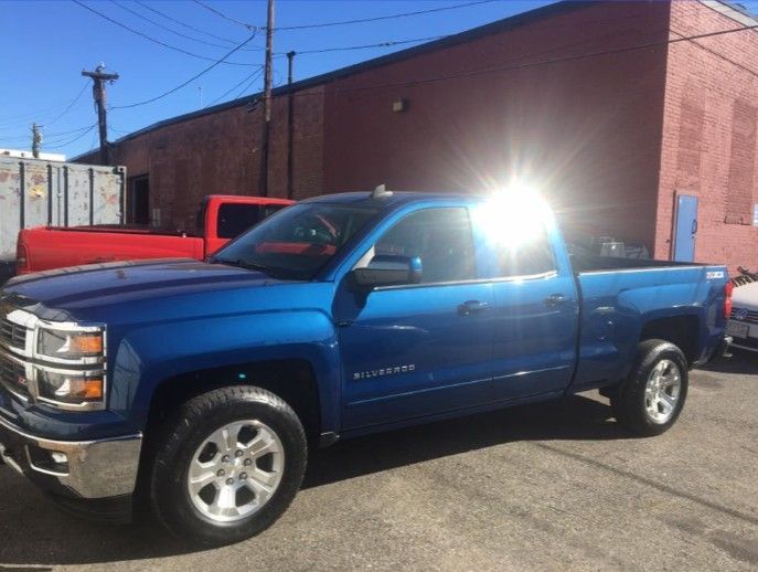 Blue pickup truck at Lou’s Custom Exhaust in Worcester, MA
