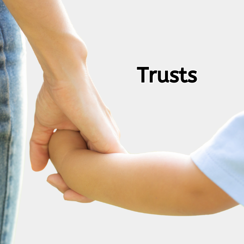 Two hands holding a key with the word trusts on it