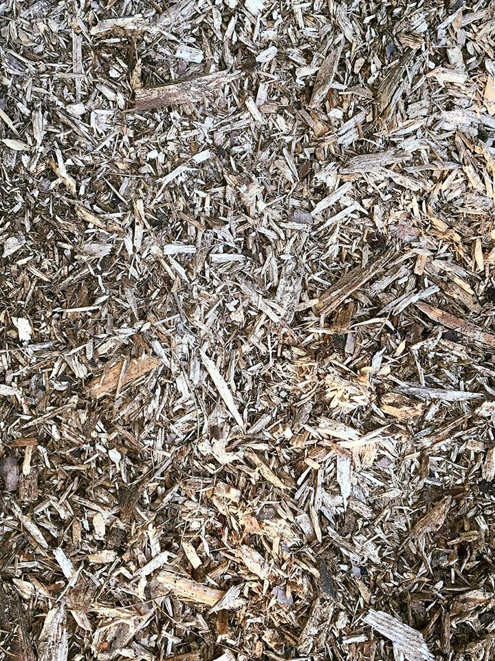 Close-up of wood chips, various shades of brown and gray.