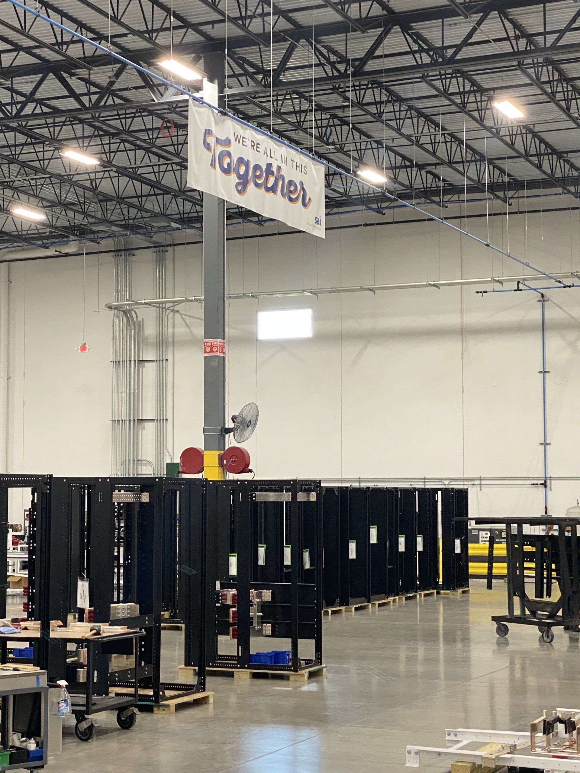 A large warehouse with a sign that says together