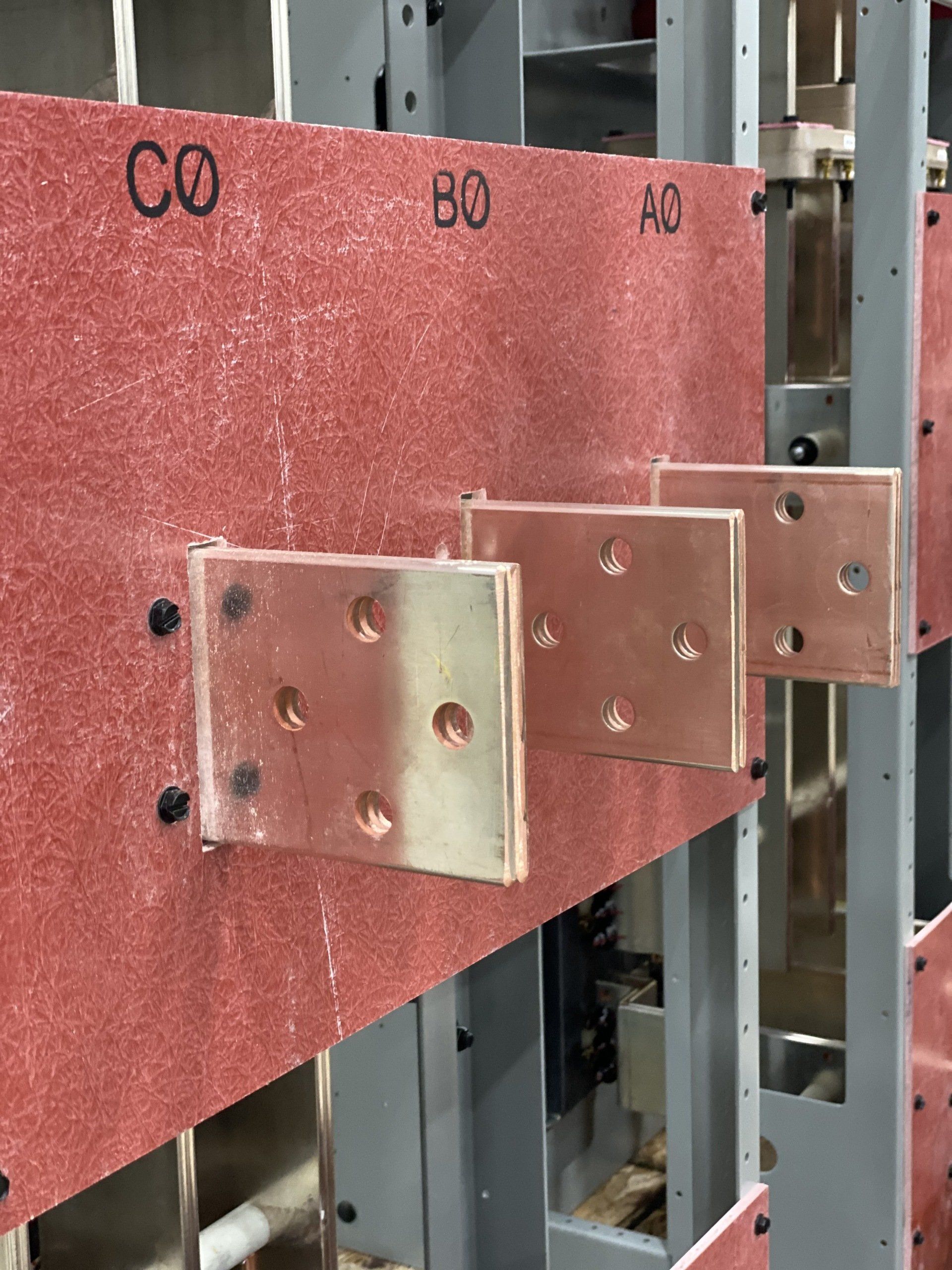 A row of copper plates with the letters co and bo on them