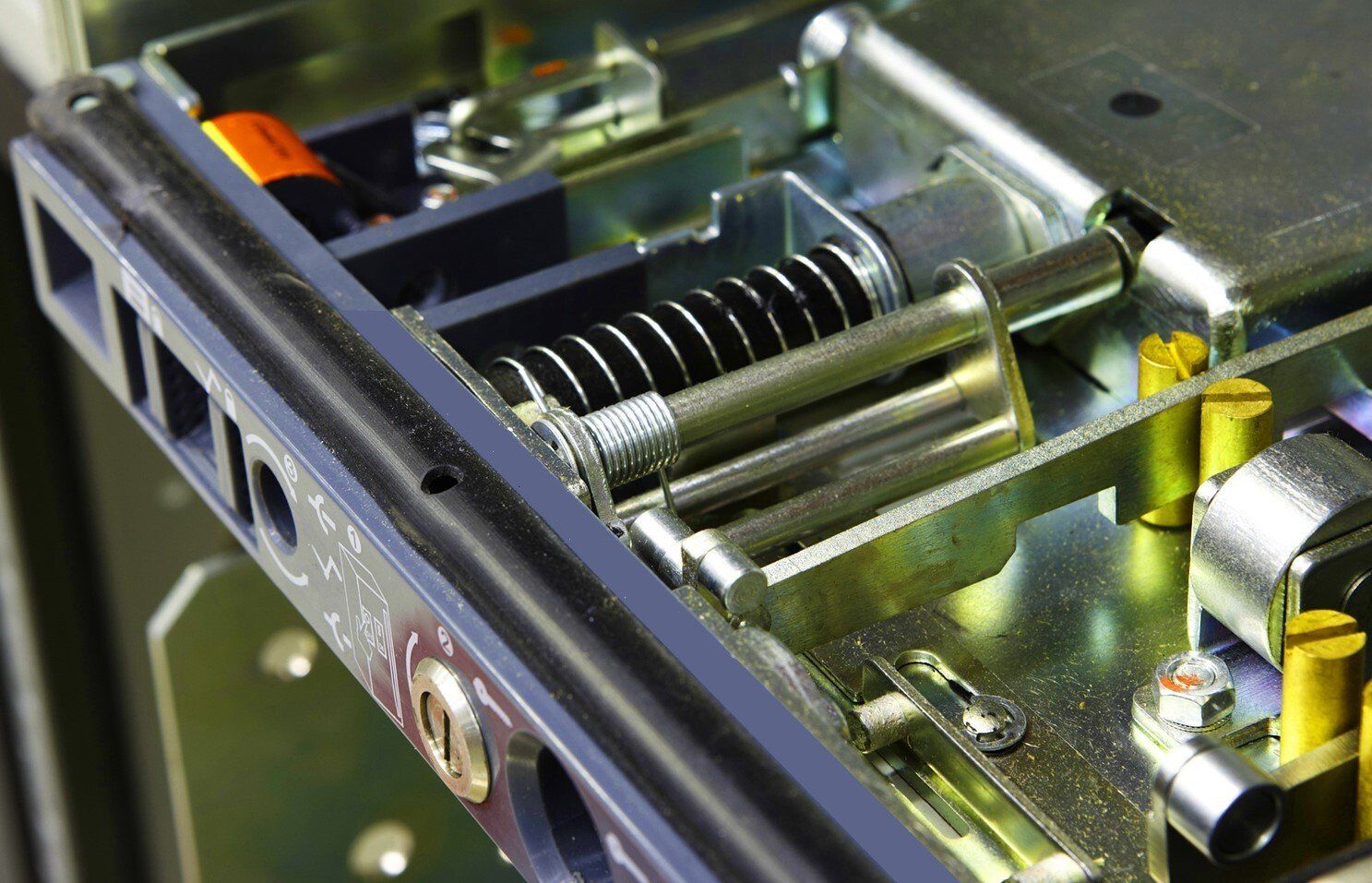 A close up of a metal item with a spring on it