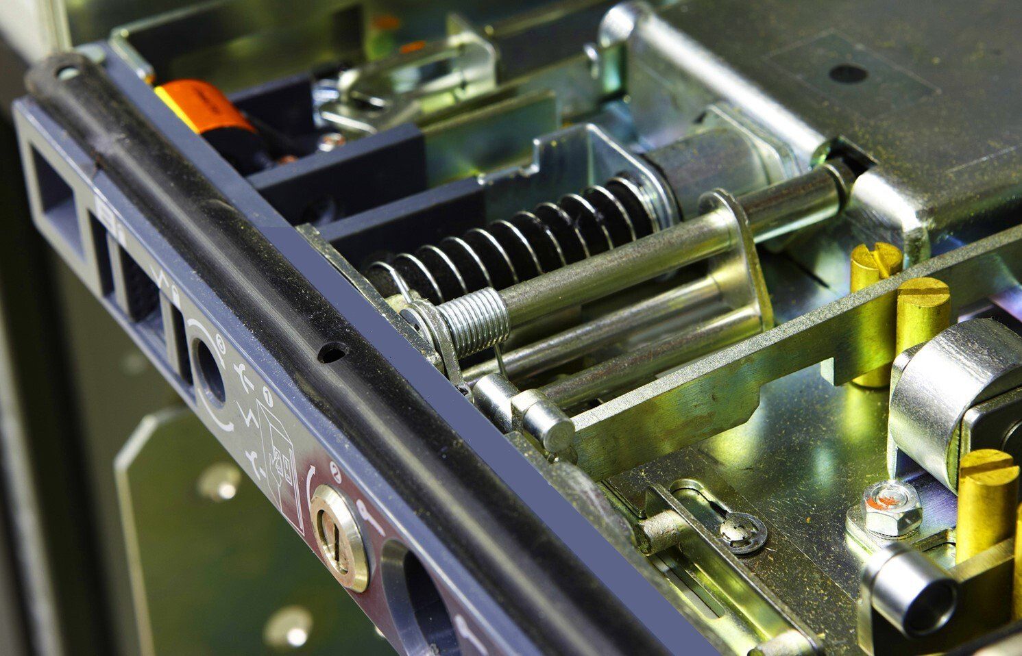 A close up of a metal item with a spring on it