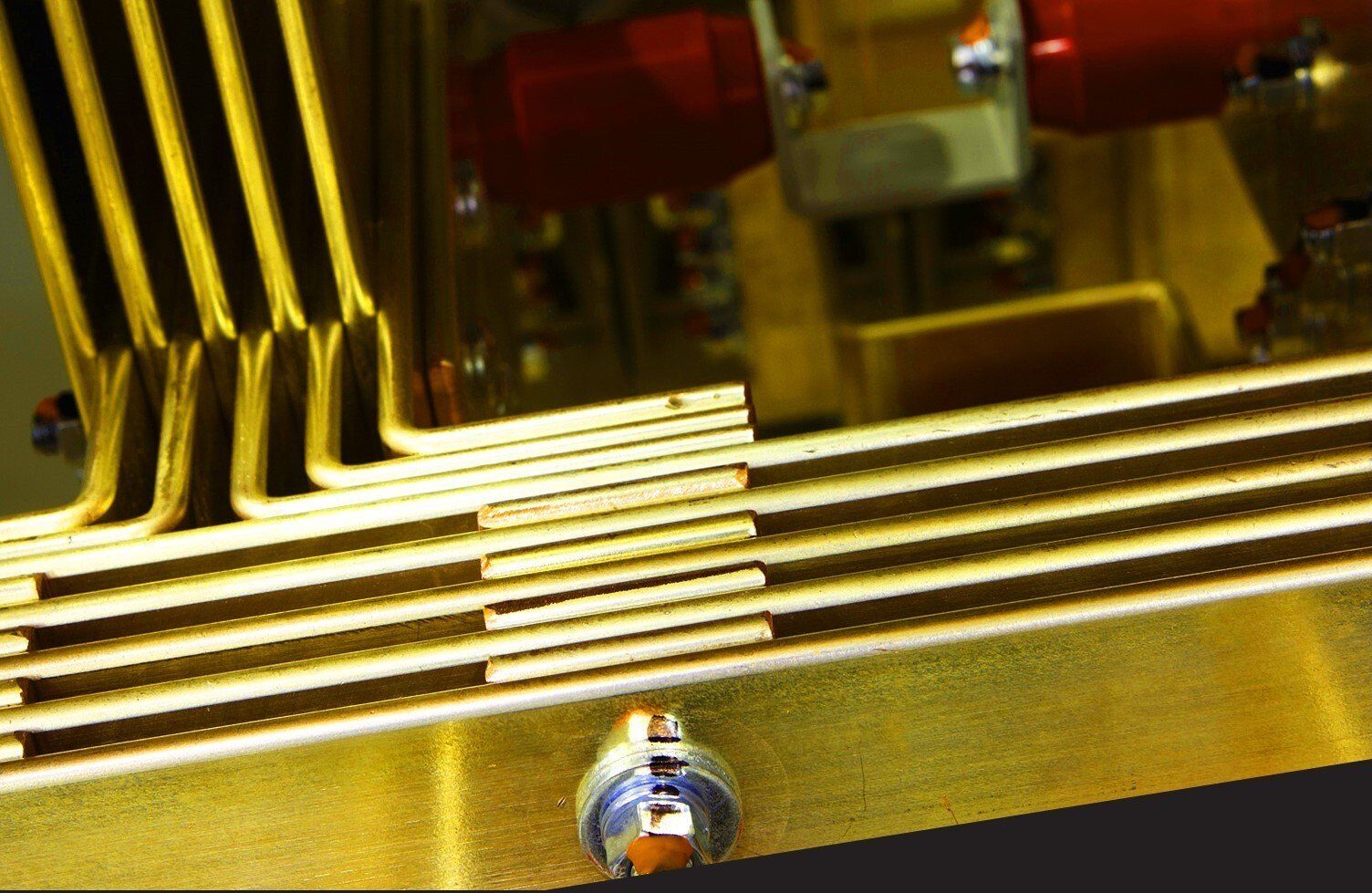 A close up of a metal object with a screw on it