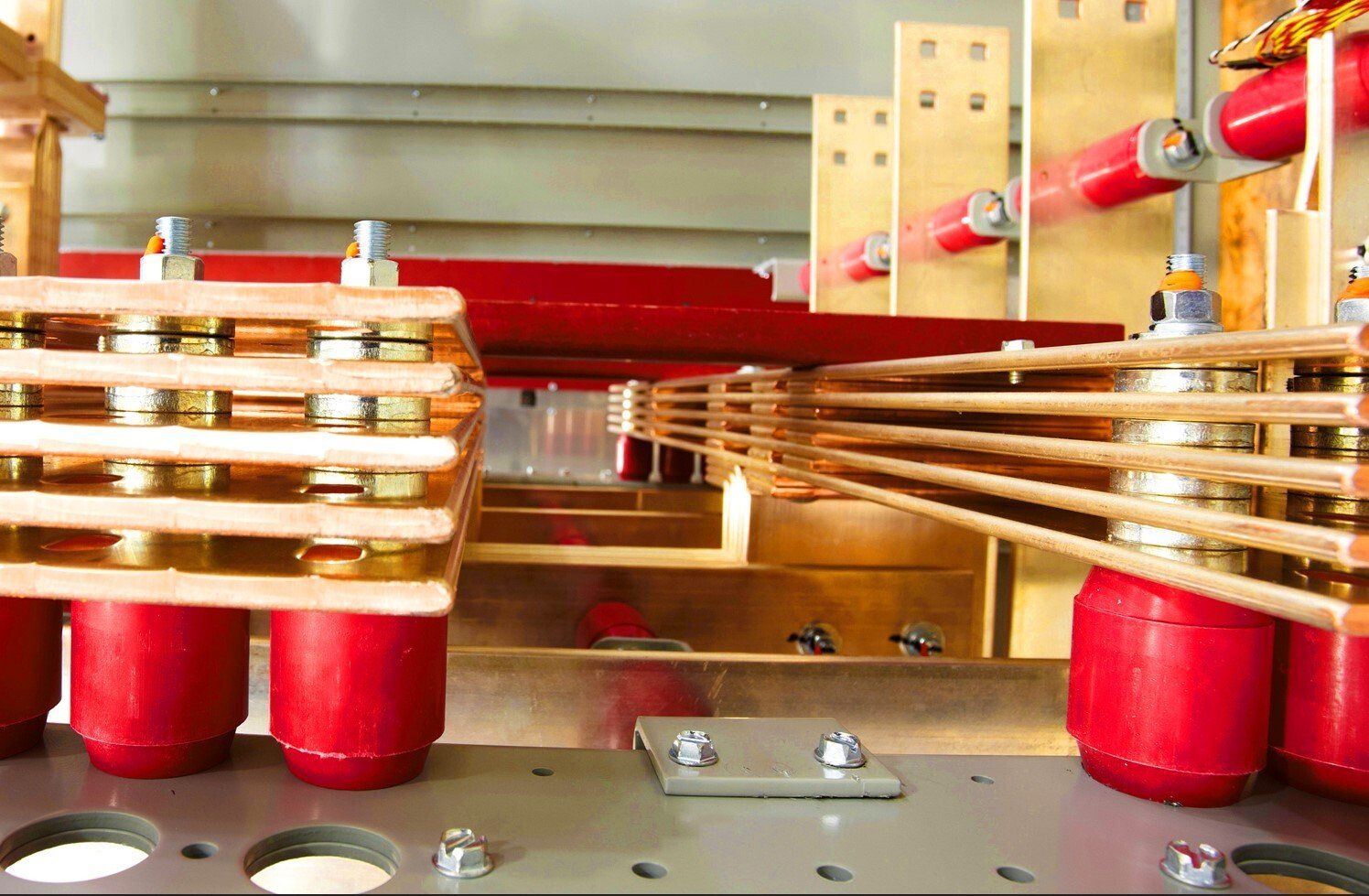 A bunch of copper wires are connected to each other on a metal surface.