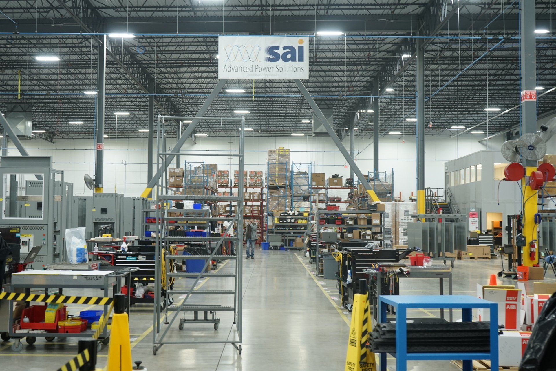 A warehouse with a sign that says sai on it