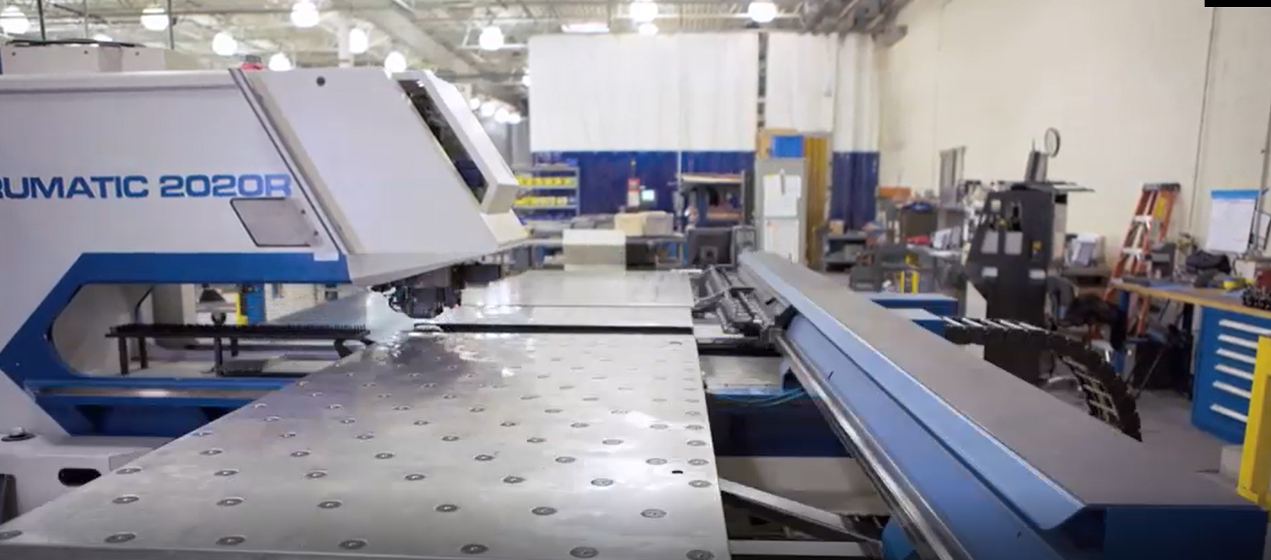 A machine is sitting on top of a table in a factory.