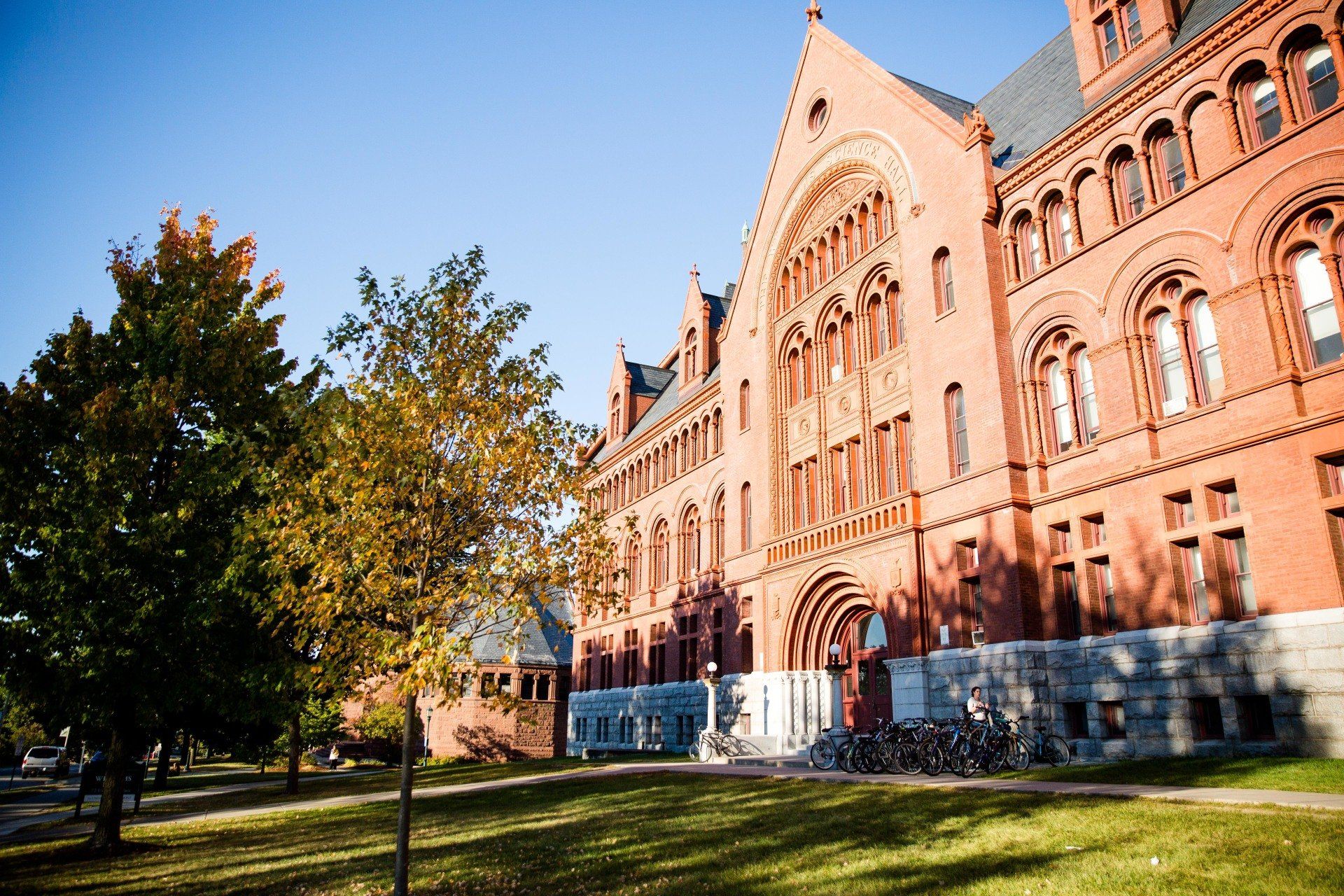 A large red brick building with trees in front of it