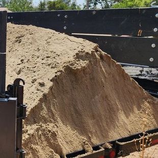 a pile of sand is sitting on top of a trailer ready to be delivered in Bakersfield, CA