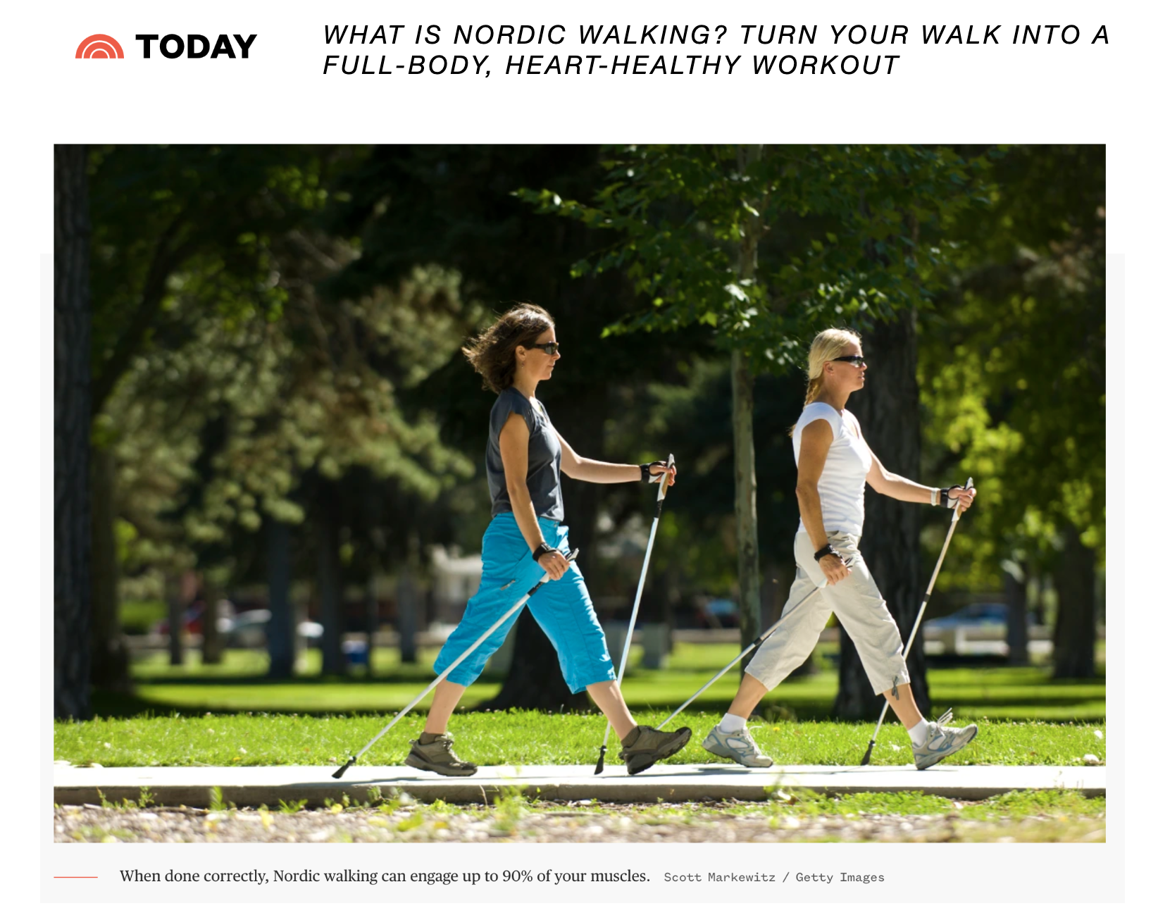 Two women are walking with nordic poles in a park