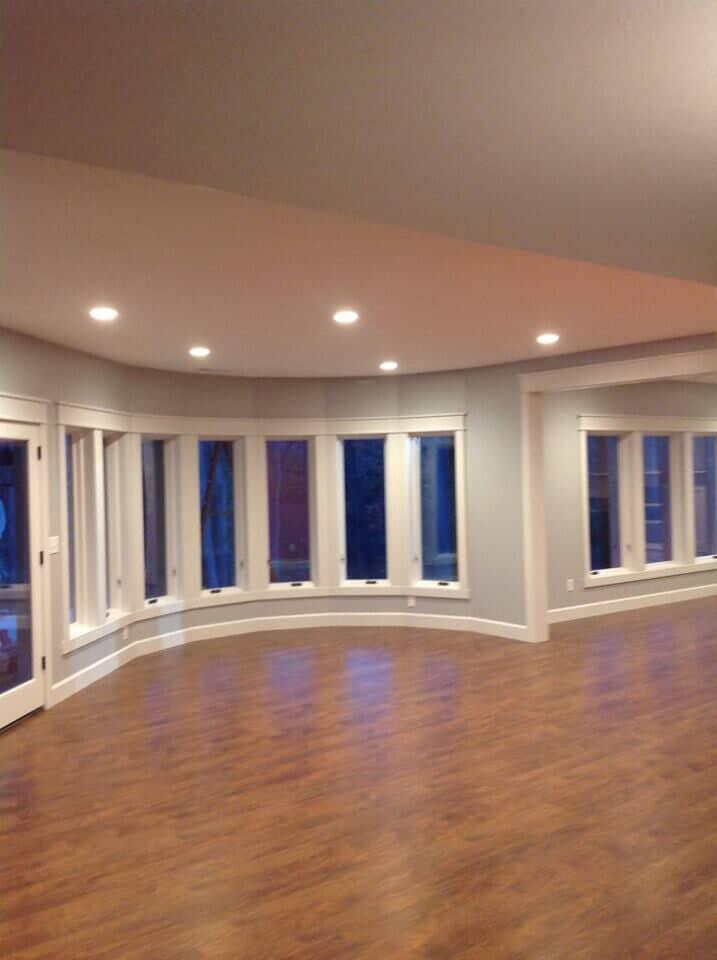 New flooring in empty room — Construction Company in Bloomington, IN