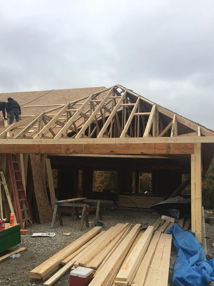 Worker repairing house frame — Construction Company in Bloomington, IN