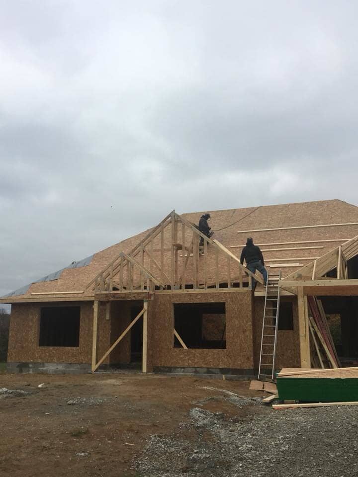 Workers repairing house frame — Construction Company in Bloomington, IN